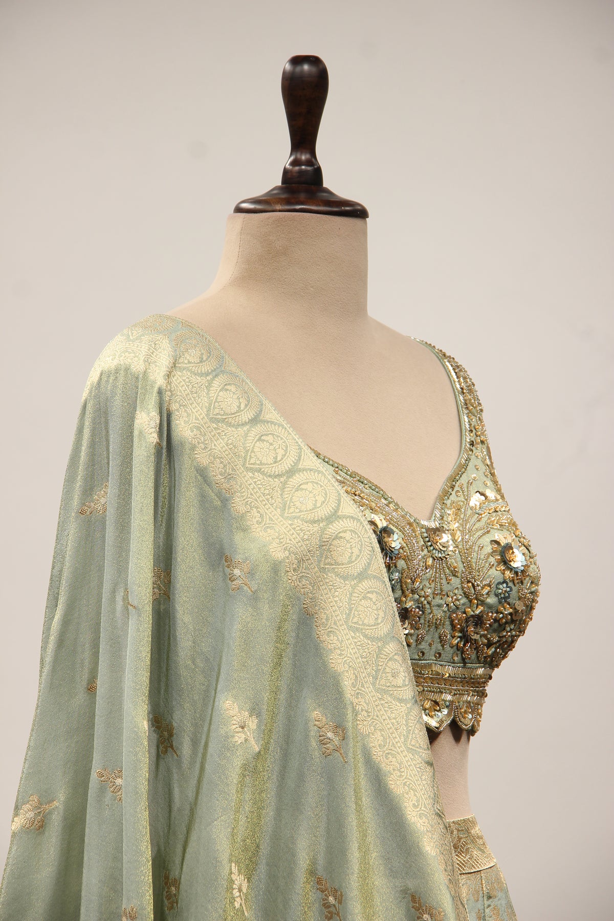 Pista Green Banarasi Brocade Lehenga with Hand Embroidery & Cut Dana – other side close-up
