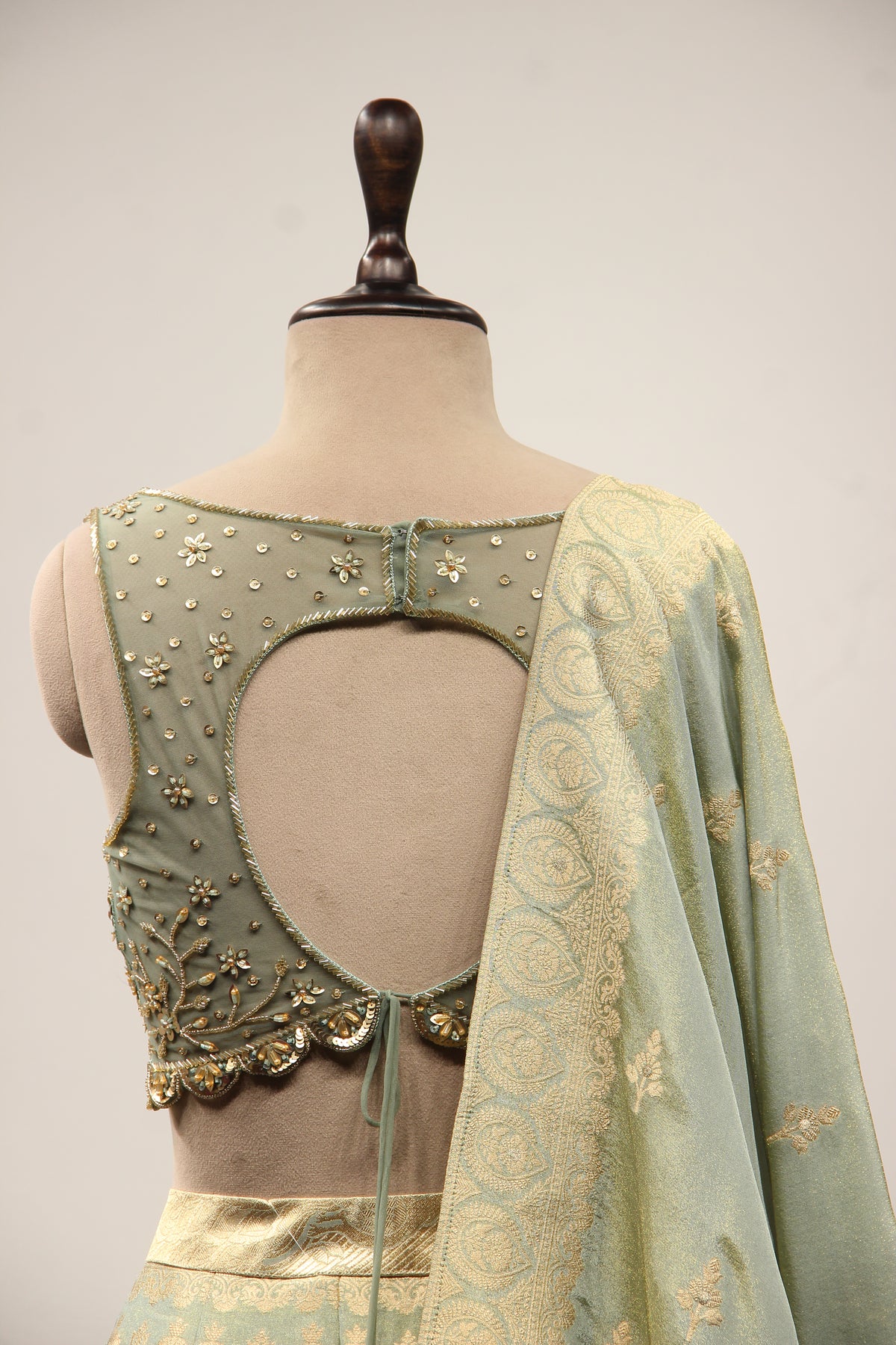 Pista Green Banarasi Brocade Lehenga with Hand Embroidery & Cut Dana – back close-up