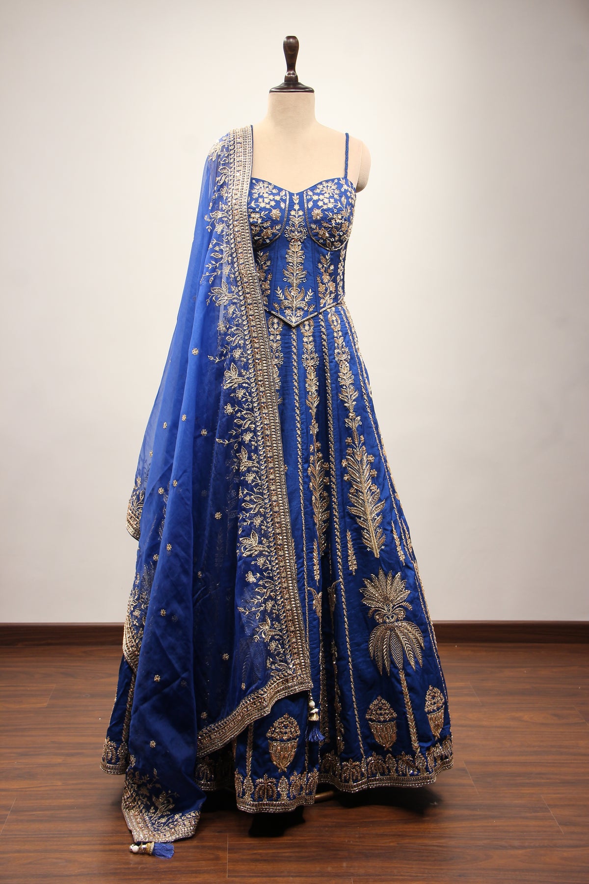 Royal Blue Dupion Lehenga with Corset Blouse, Zari & Cut Dana Handwork in Blue – front view