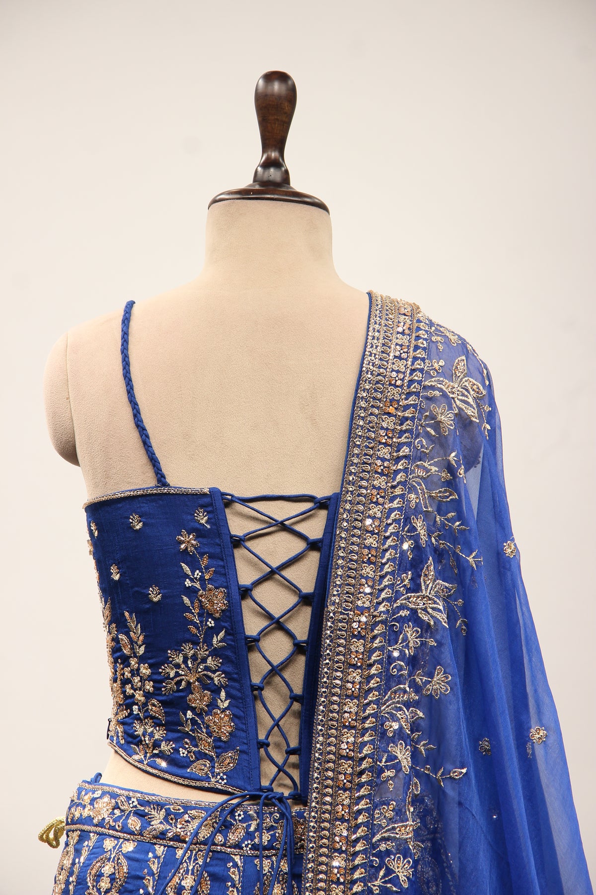 Royal Blue Dupion Lehenga with Corset Blouse, Zari & Cut Dana Handwork in Blue – back close-up