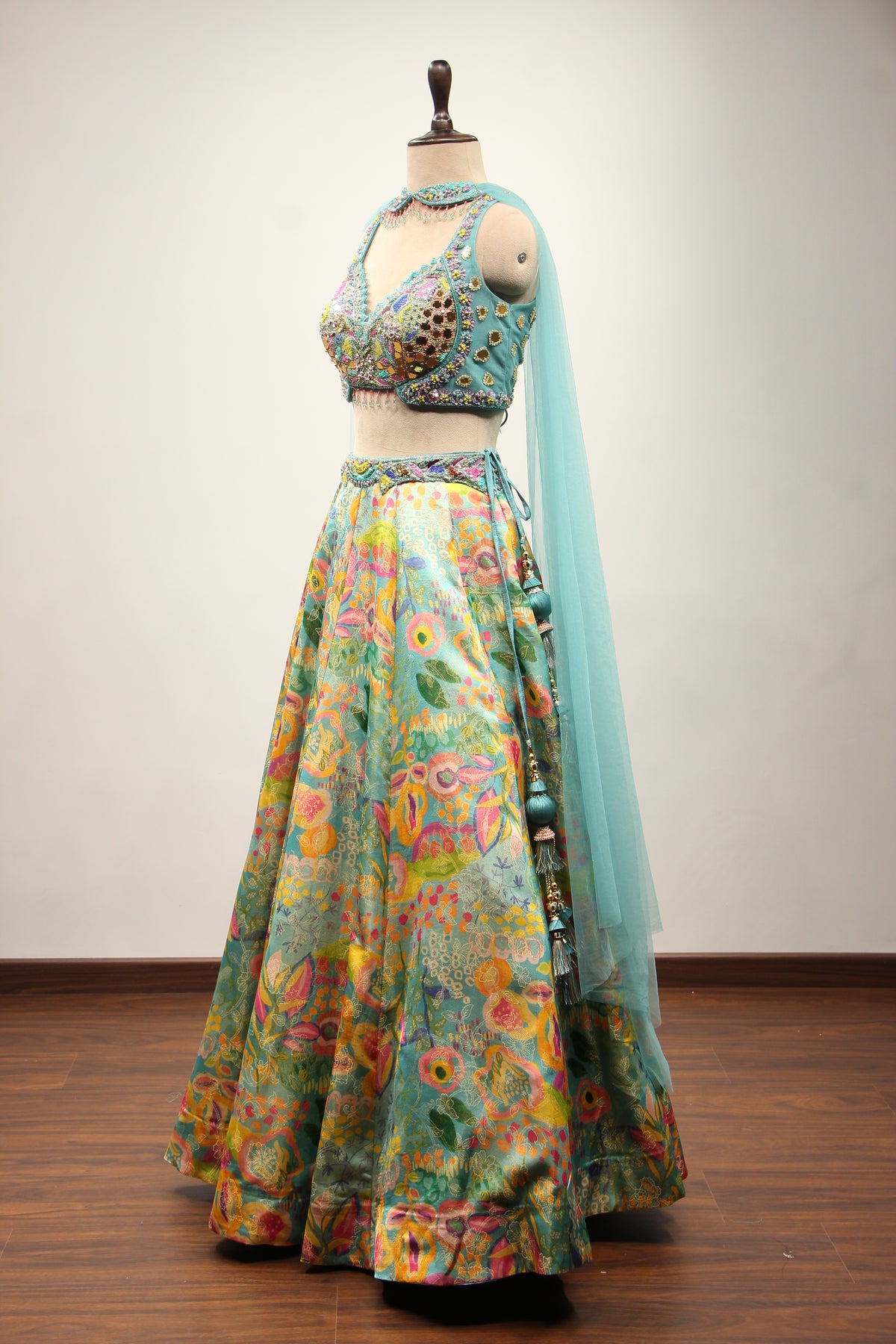 Blue Printed Tissue Lehenga with Hand Embroidery & Mirror Crop Top – side view