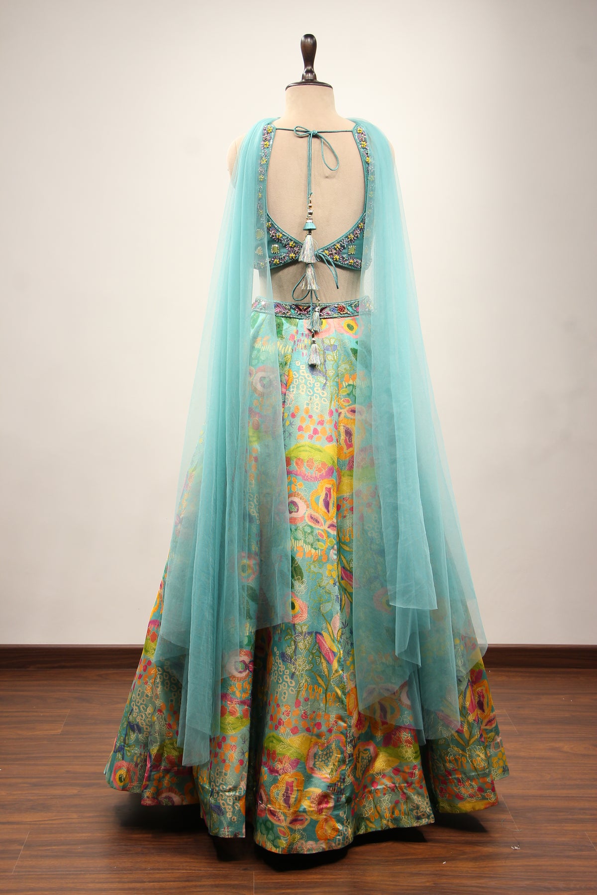 Blue Printed Tissue Lehenga with Hand Embroidery & Mirror Crop Top – back view