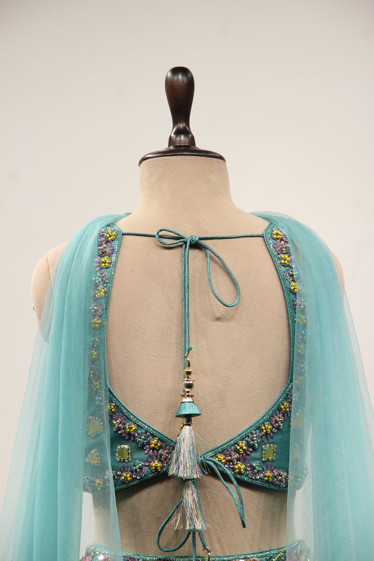 Blue Printed Tissue Lehenga with Hand Embroidery & Mirror Crop Top – back close-up