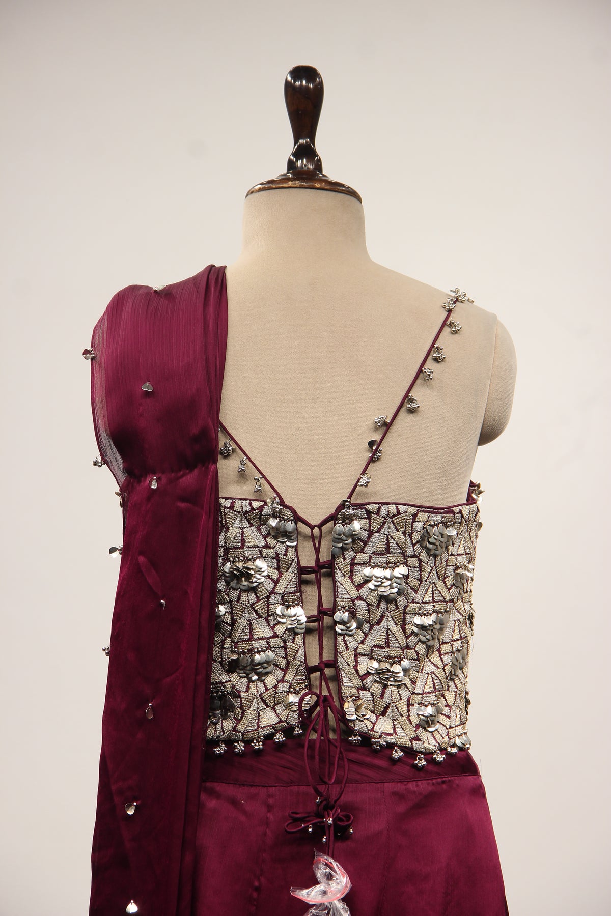 Wine Crepe Drape Saree with Zari & Sequin Handwork Strappy Corset – back close-up