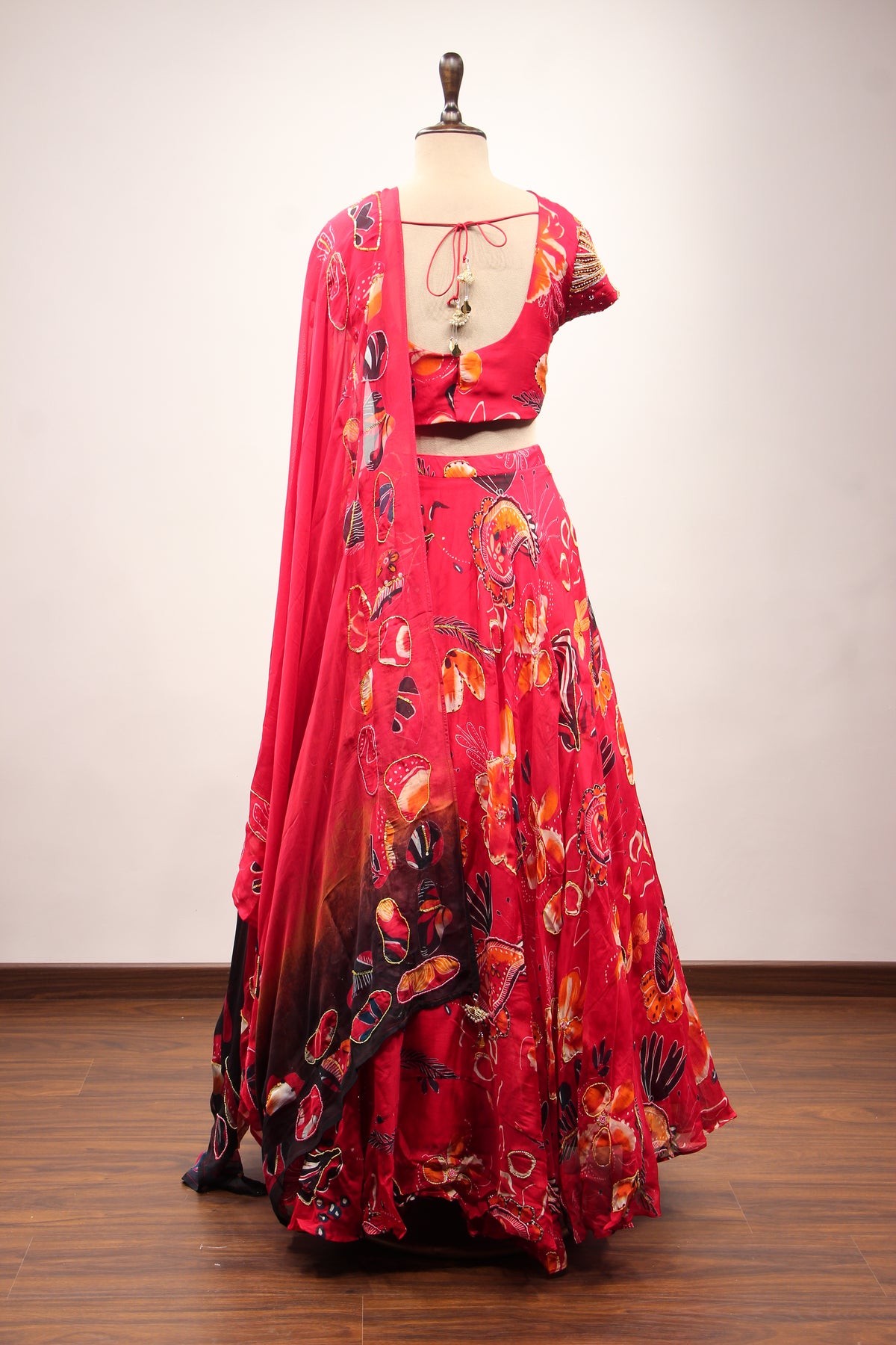 Red Organza Lehenga with Printed & Cut Dana Handwork Cap Sleeve Top – back view