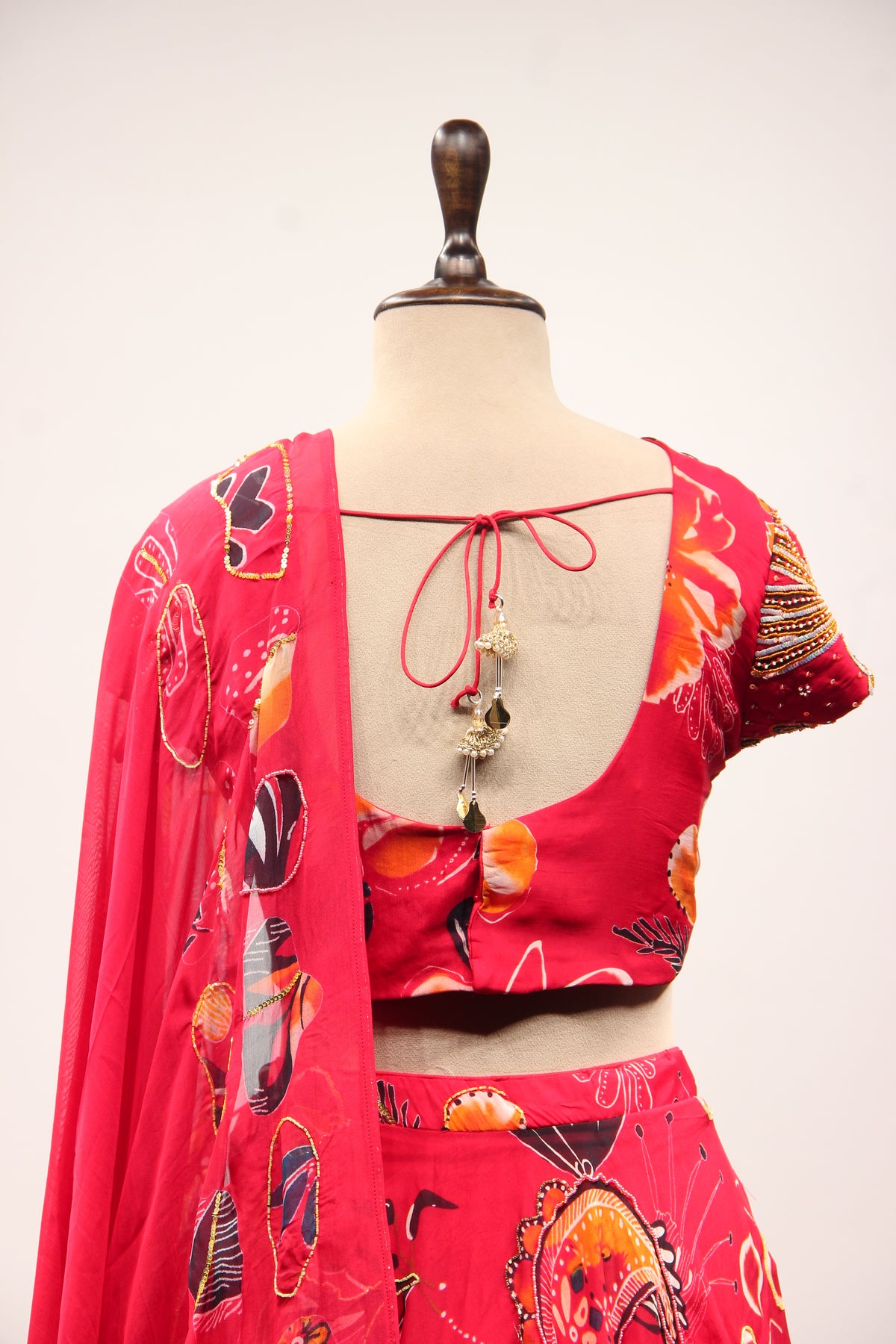 Red Organza Lehenga with Printed & Cut Dana Handwork Cap Sleeve Top – back close-up
