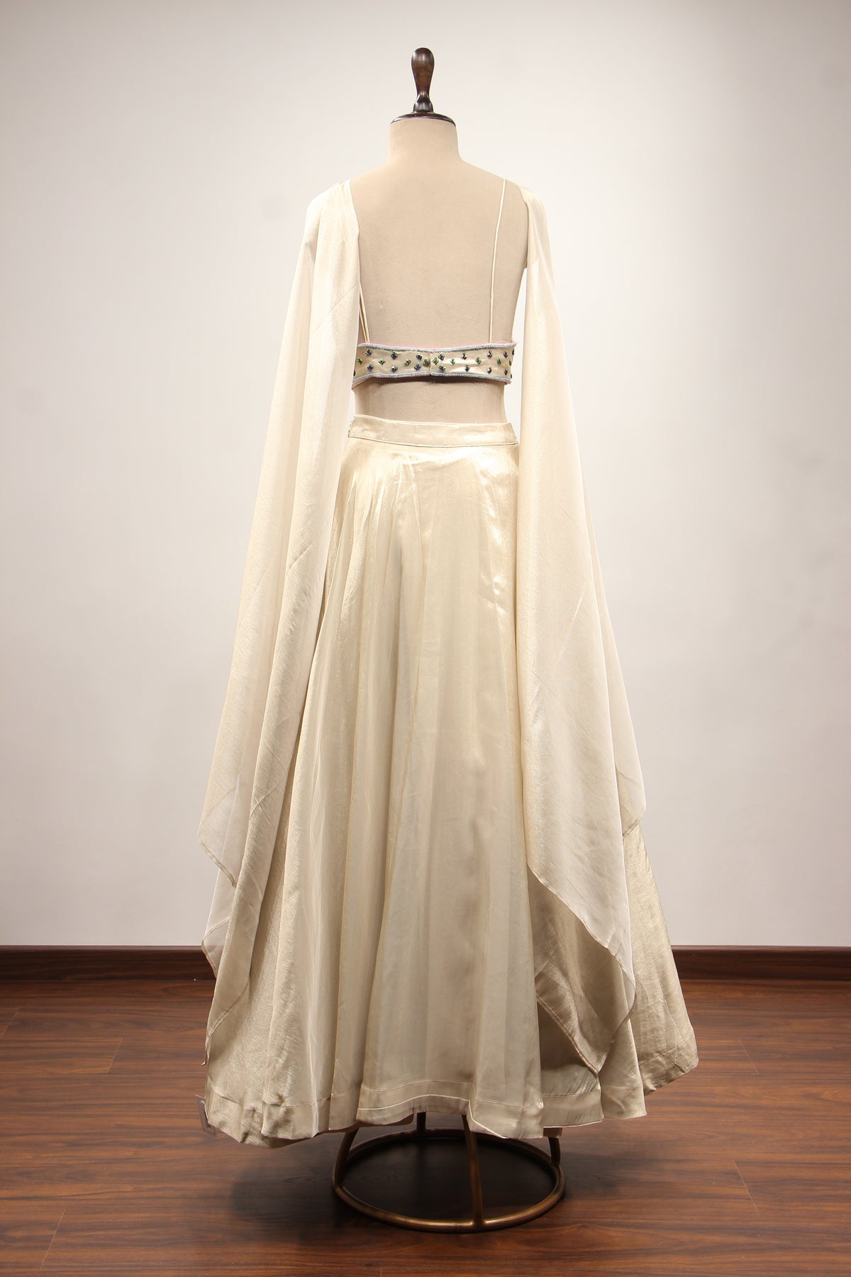 Ivory Shimmer Tissue Lehenga with Sequin & Cut Dana Handwork Crop Top – back view
