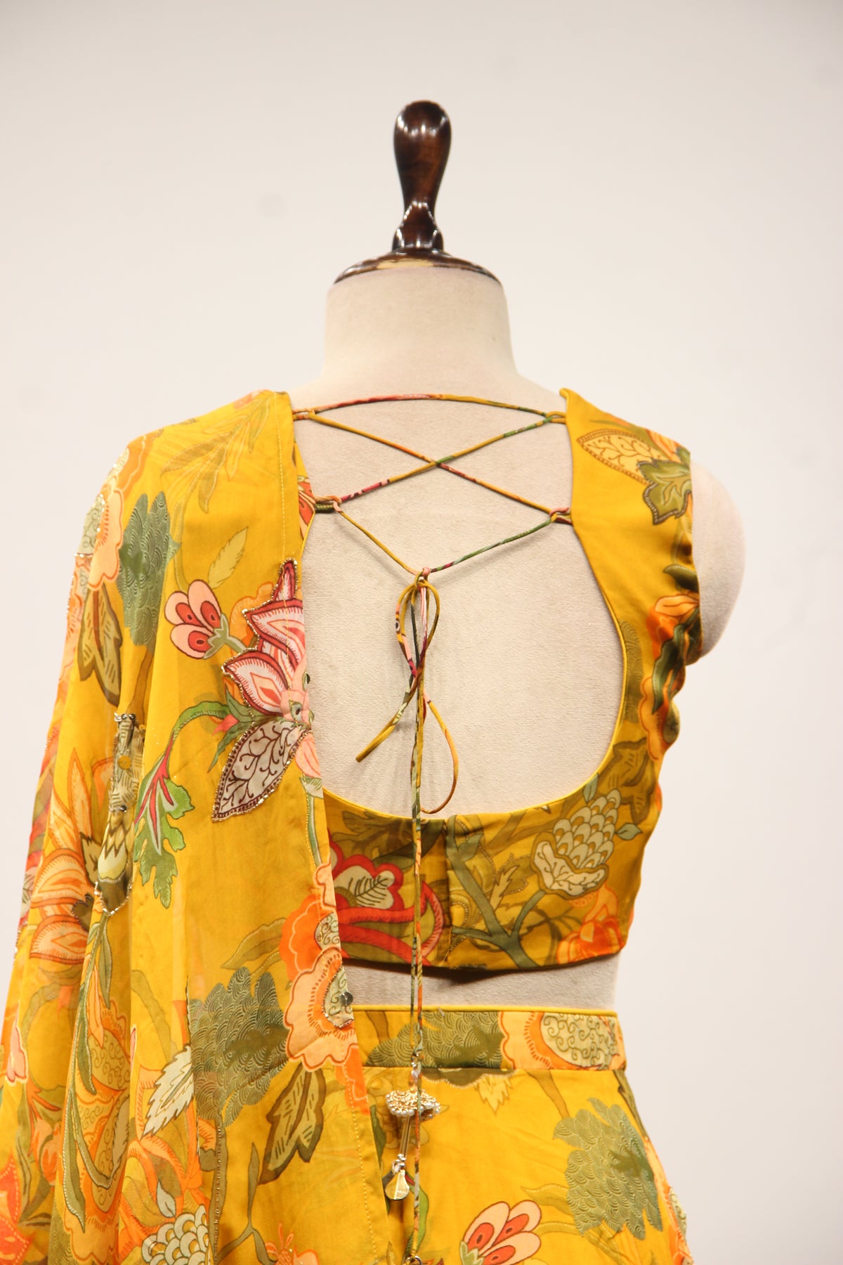 Mustard Floral Organza Lehenga with Printed & Mirror Handwork Crop Top – back close-up
