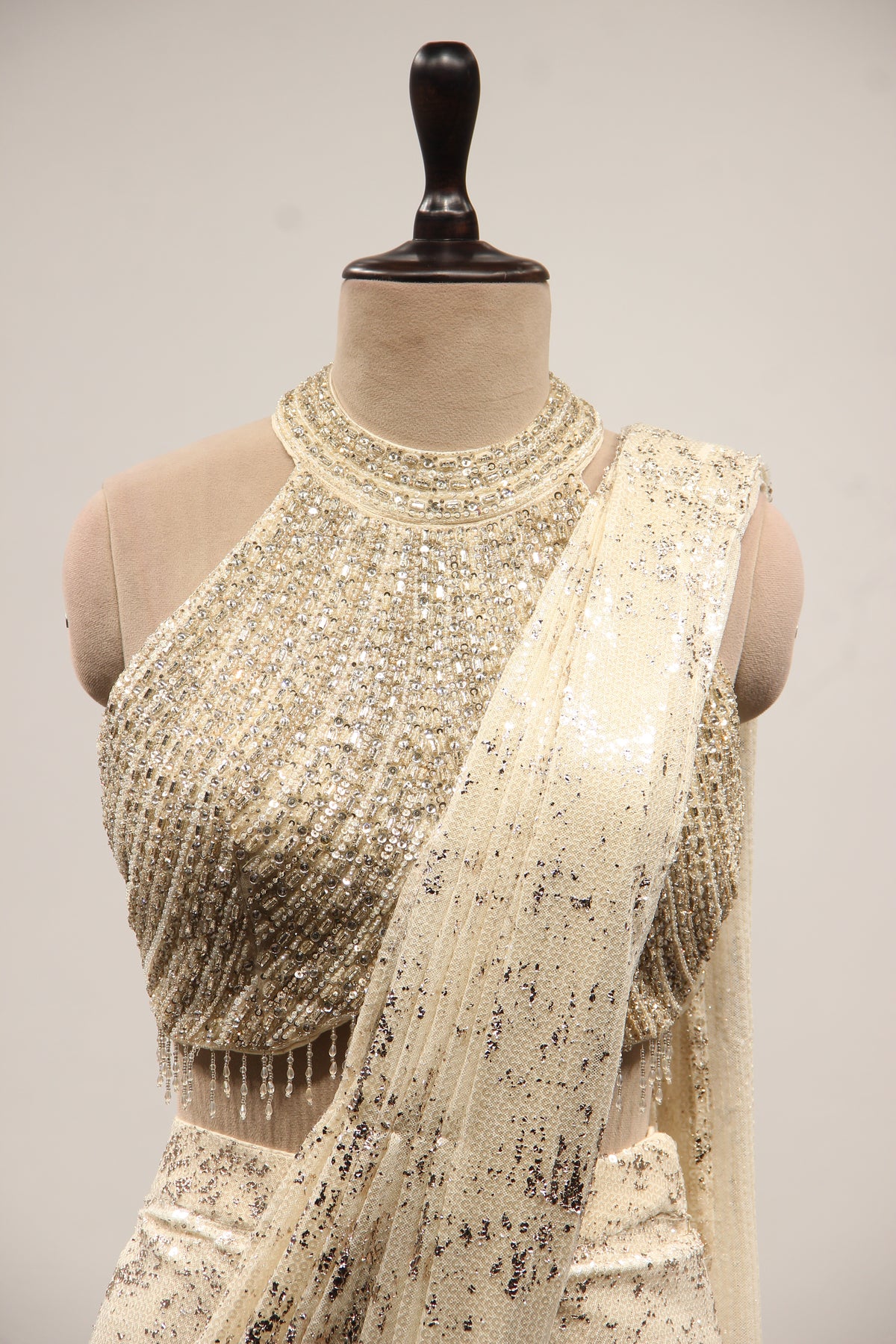 Imported Halter Neck Drape Saree with Mirror & Sequin Handwork in Cream – front close-up