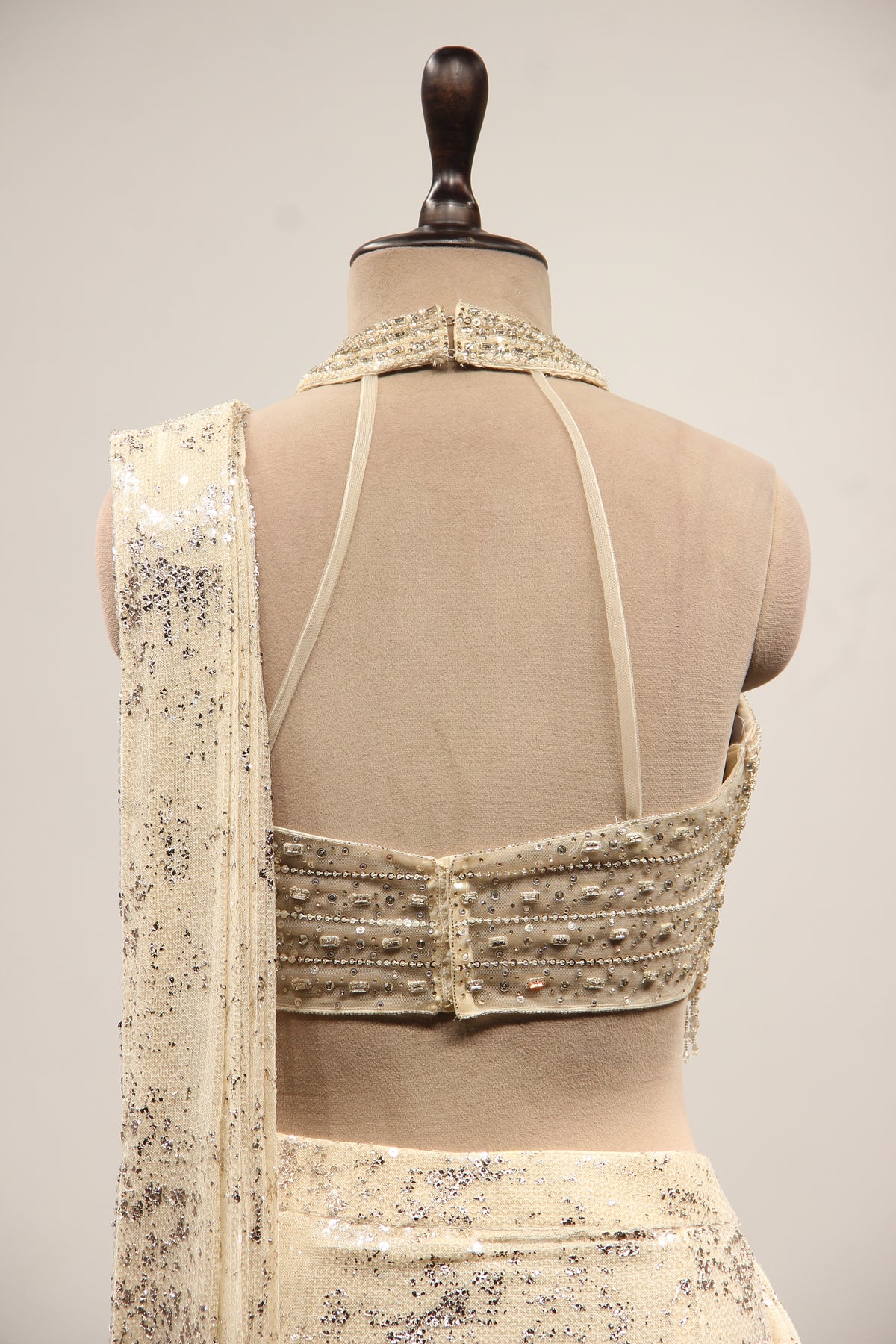 Imported Halter Neck Drape Saree with Mirror & Sequin Handwork in Cream – back close-up