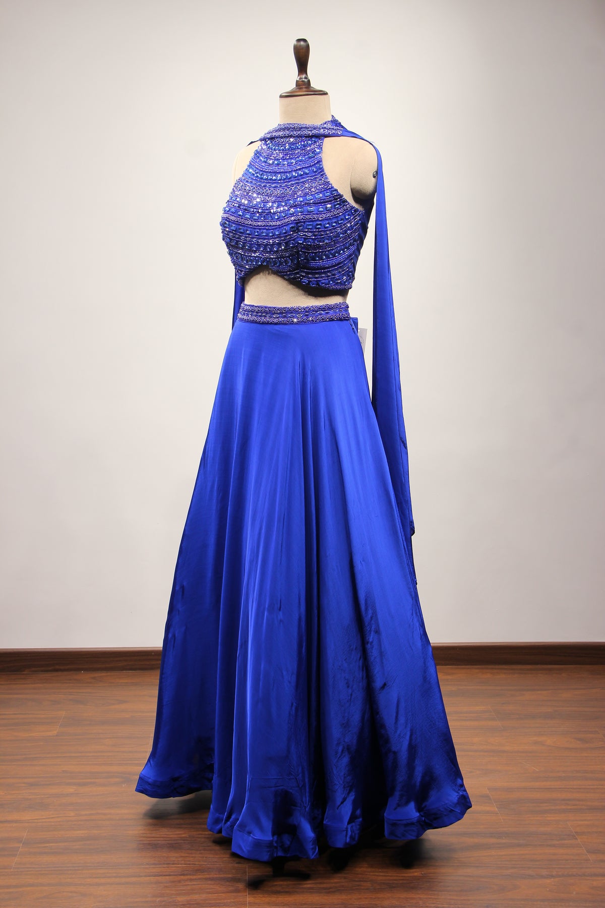 Electric Blue Crepe Halter Lehenga with Stone & Cut Dana Handwork – side view