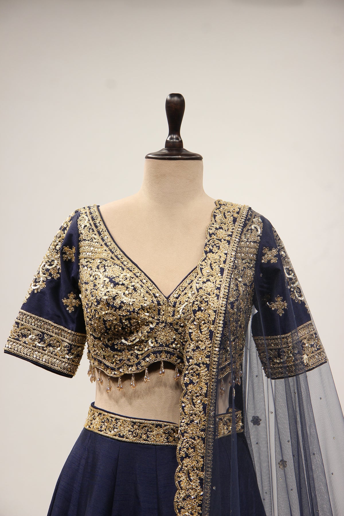 Dupion Lehenga with Zari & Sequin Handwork Half Sleeve V-Neck Crop Top in Blue – front close-up