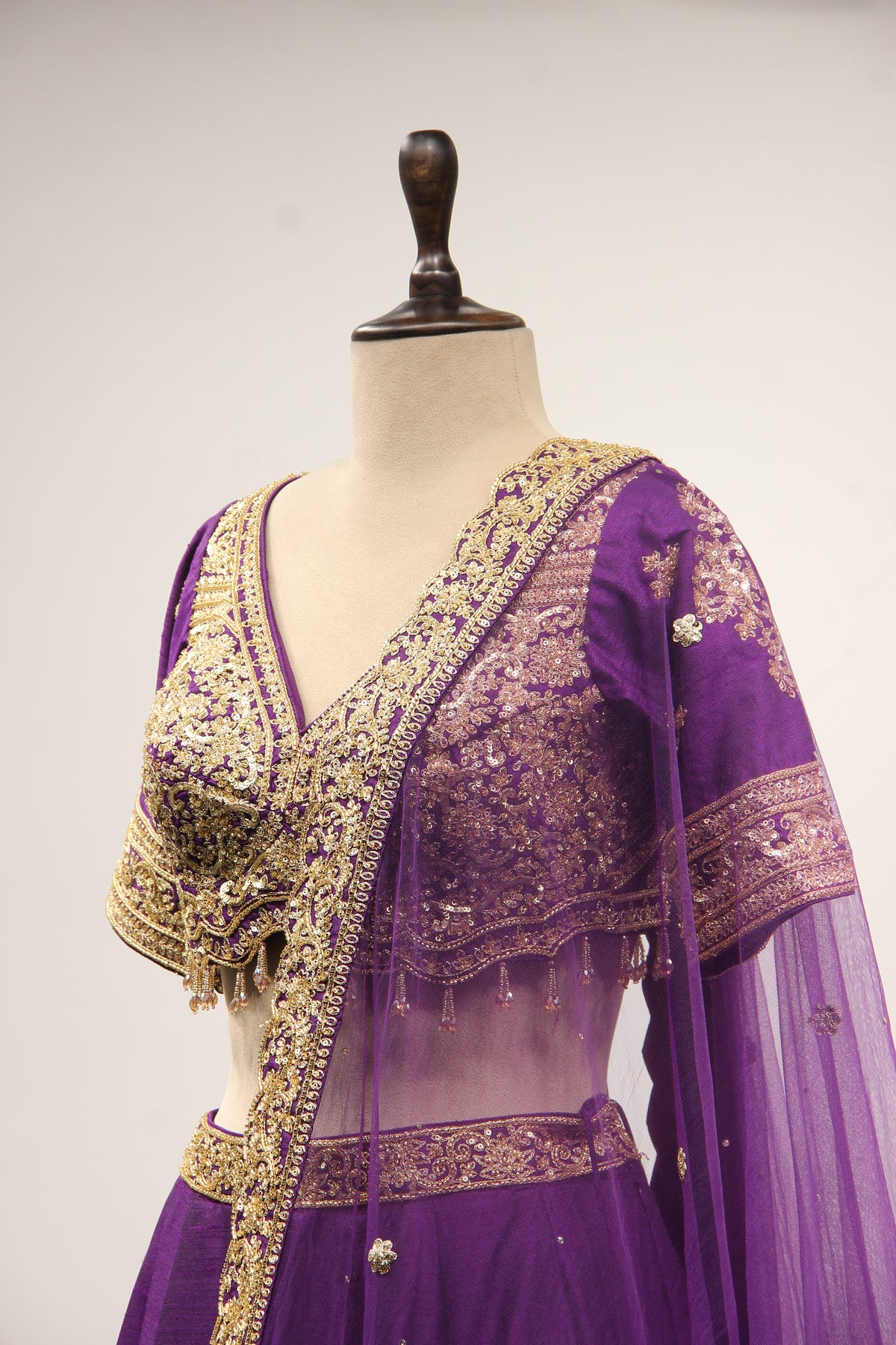 Dupion Lehenga with Zari & Sequin Handwork Half Sleeve V-Neck Crop Top in Purple – side close-up