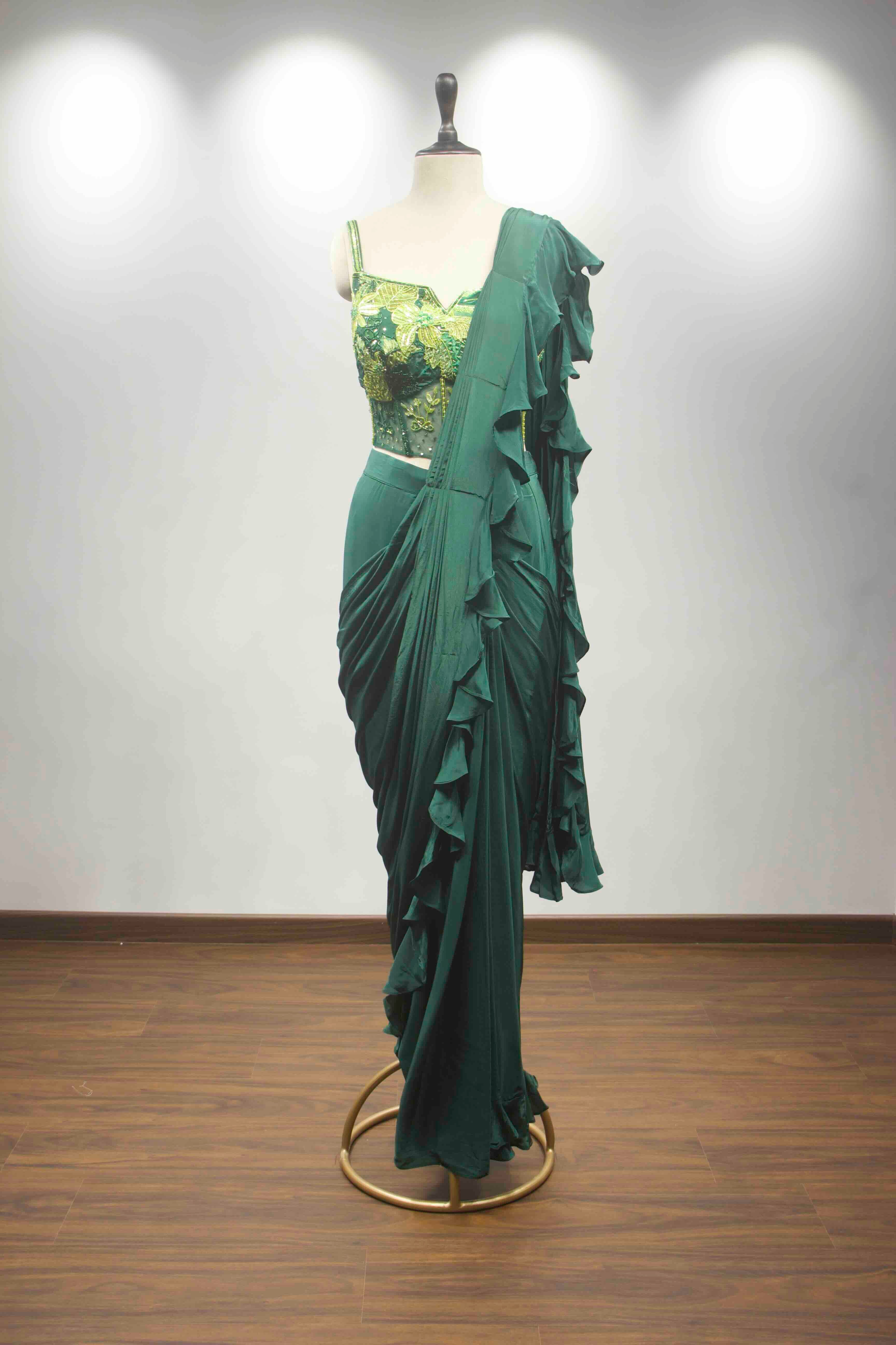 hand emb blouse green drape saree