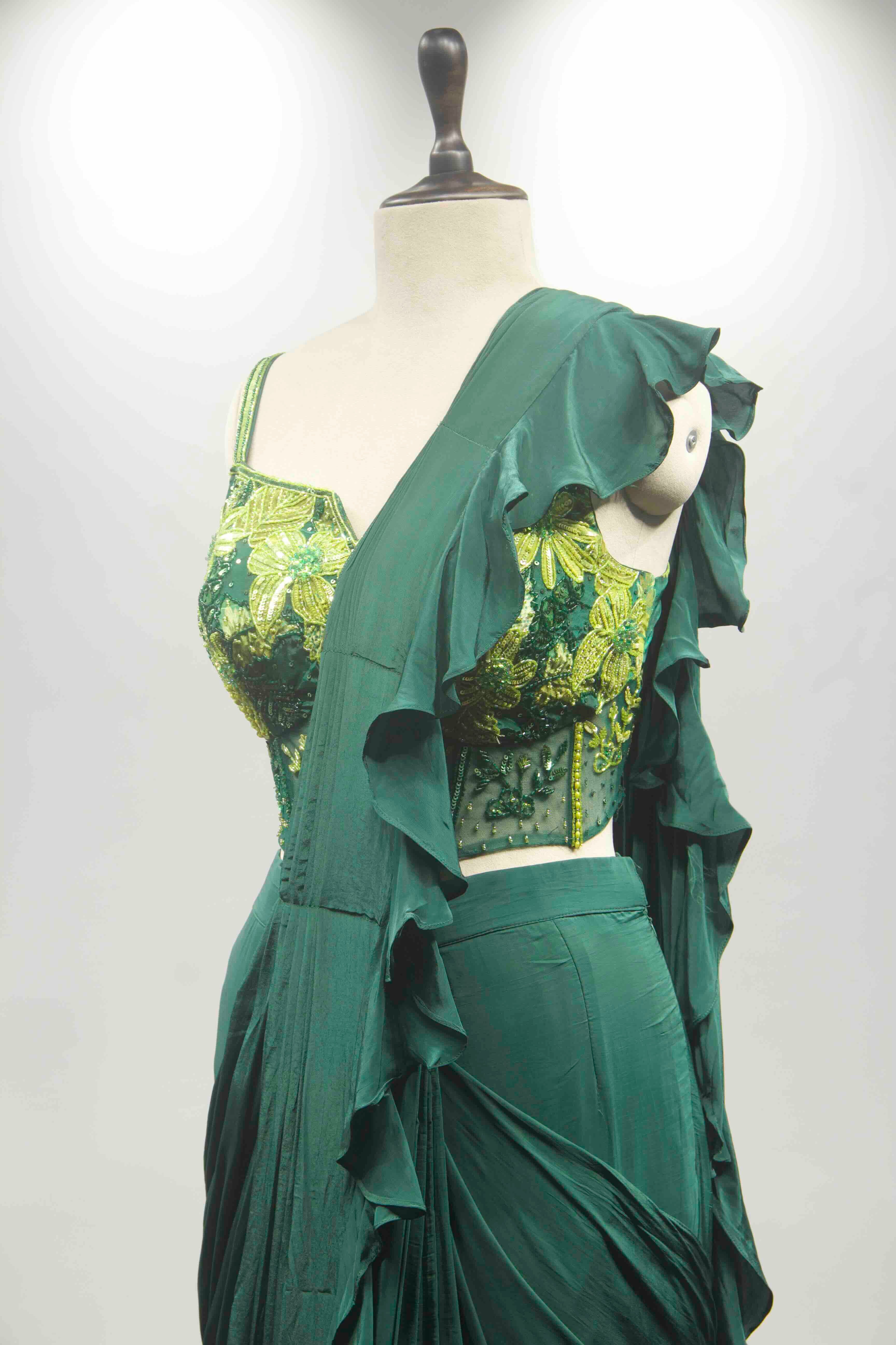 hand emb blouse green drape saree