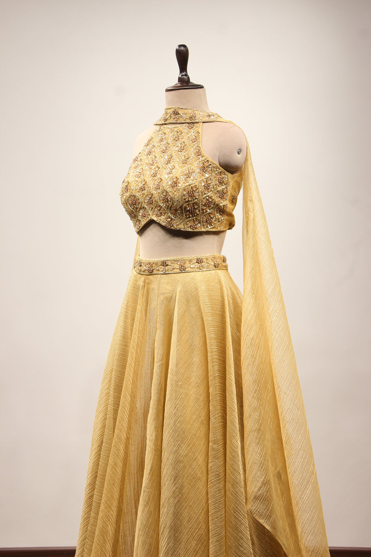 Gold Shimmer Tissue Halter Neck Lehenga with Cut Dana & Bead Handwork – side view