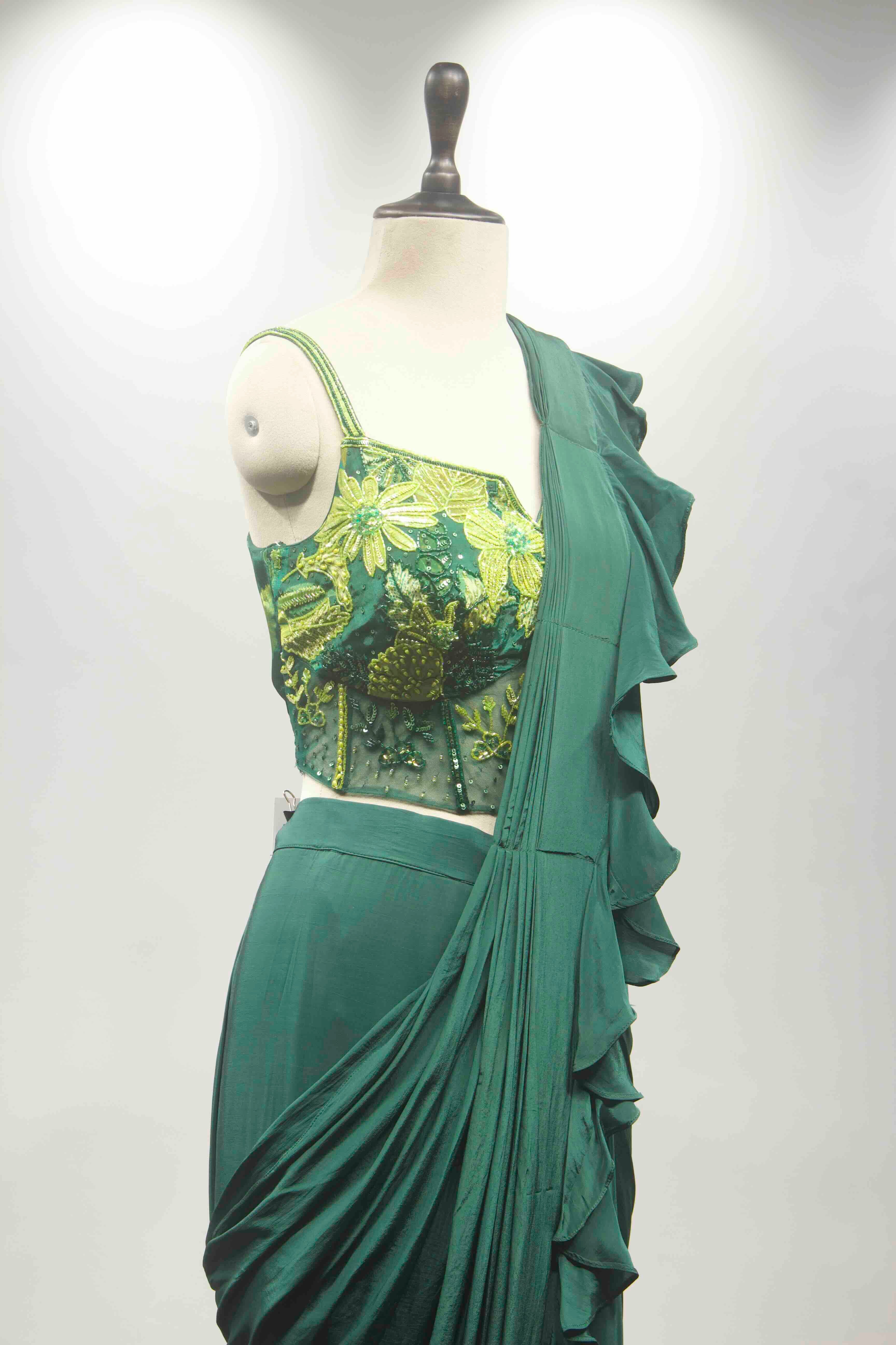 hand emb blouse green drape saree