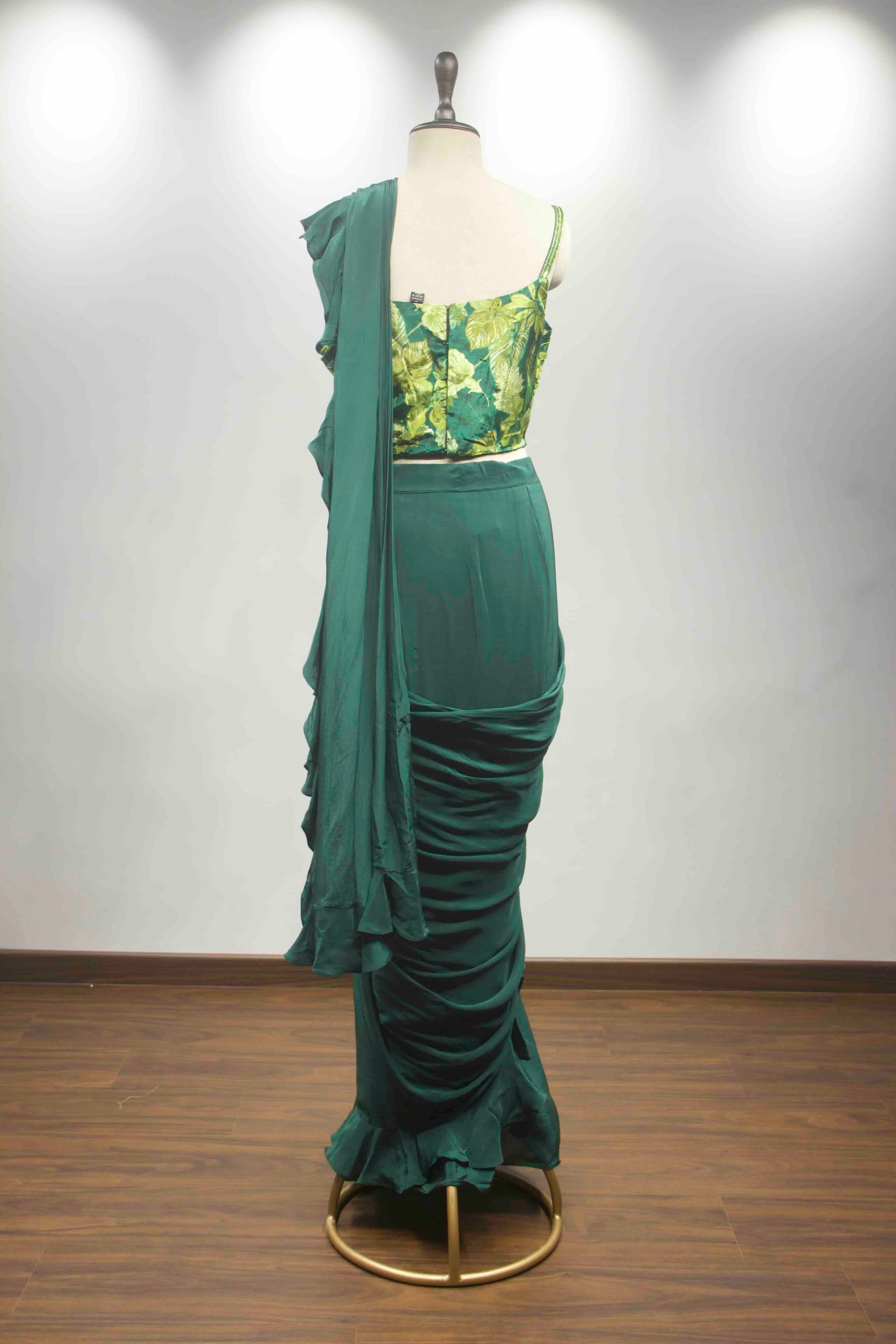 hand emb blouse green drape saree