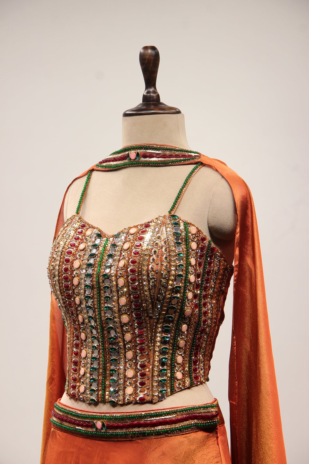 Rust Shimmer Tissue Corset Lehenga in Hand Embroidery & Stone Handwork – side close-up