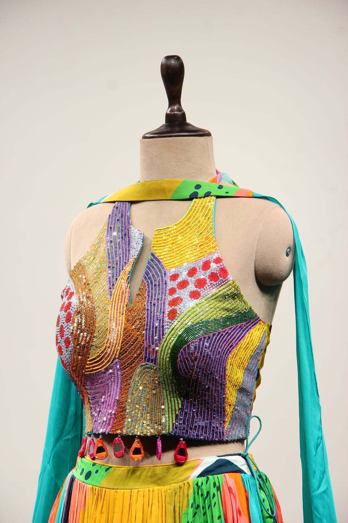 Multicolor Printed Crepe Halter Lehenga with Sequin & Bead Handwork – side close-up