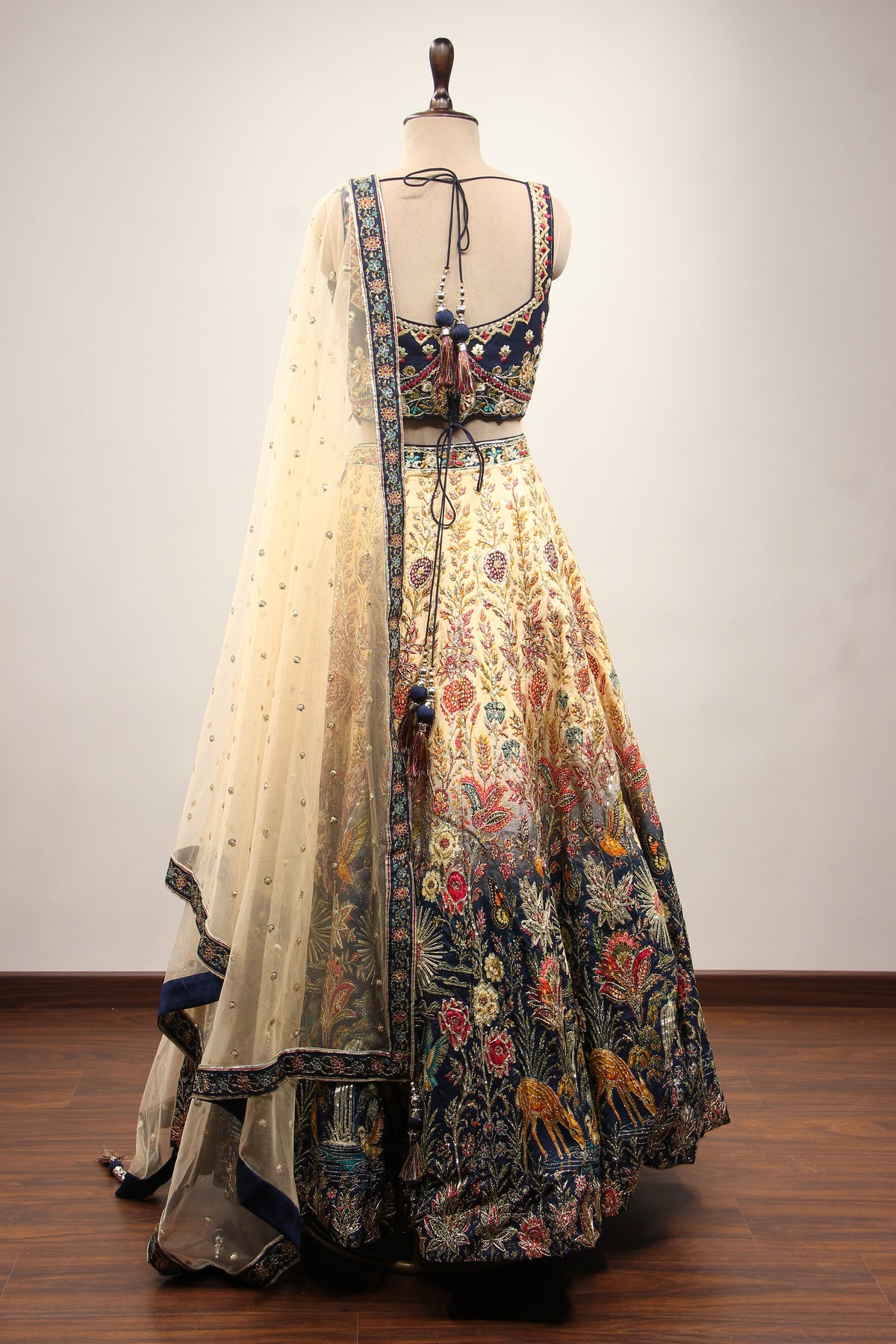 Ivory Ombre Dupion Corset Lehenga with Printed & Gota Patti Handwork – back view