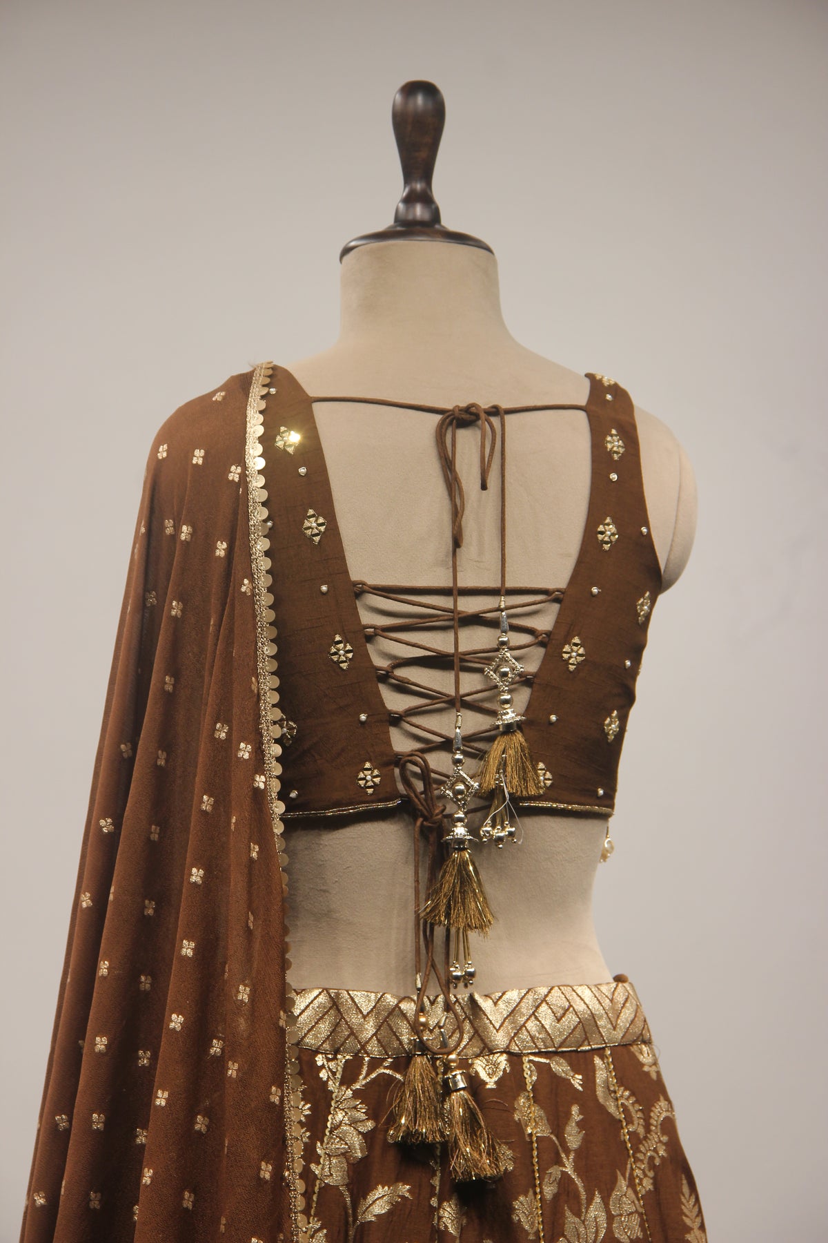 Brown Banarasi Brocade Corset Lehenga with Hand Embroidery & Mirror Handwork