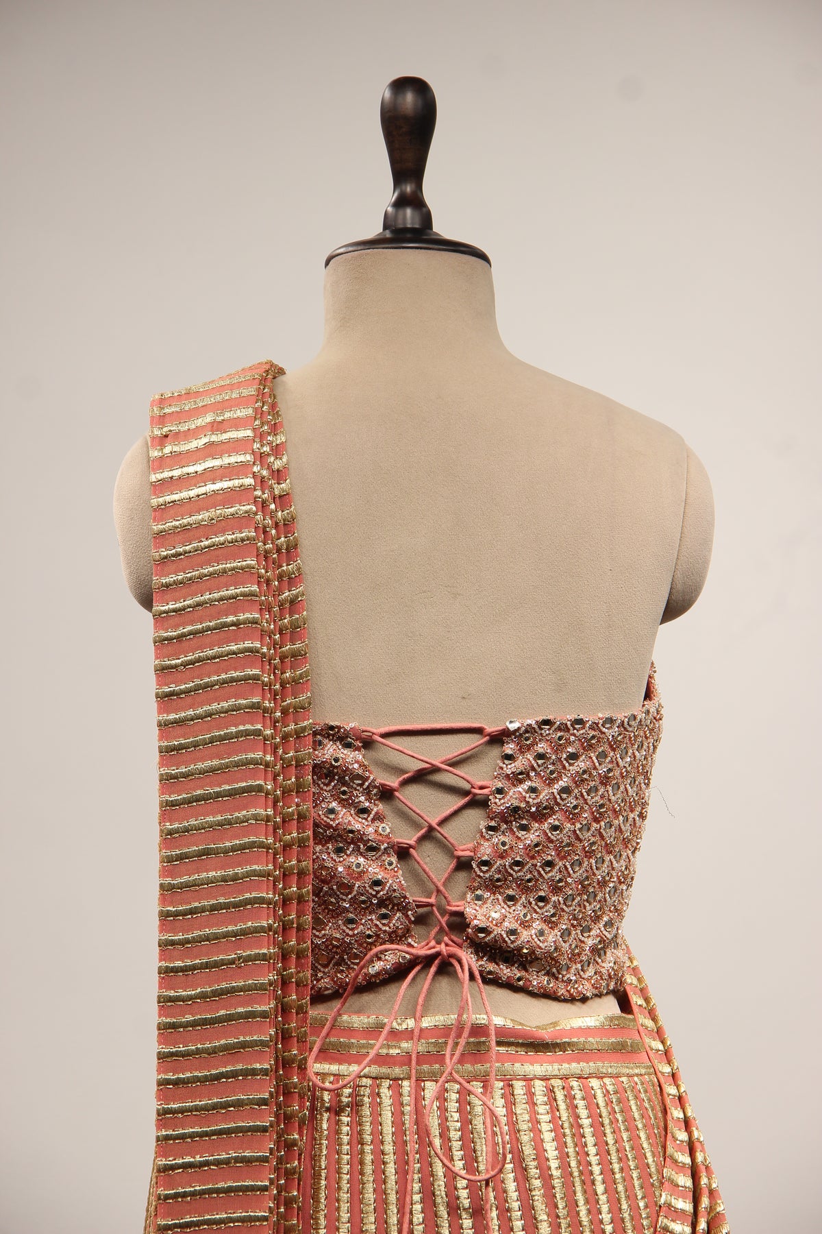Georgette Drape Saree with Mirror & Pearl Handwork Corset Blouse in Peach