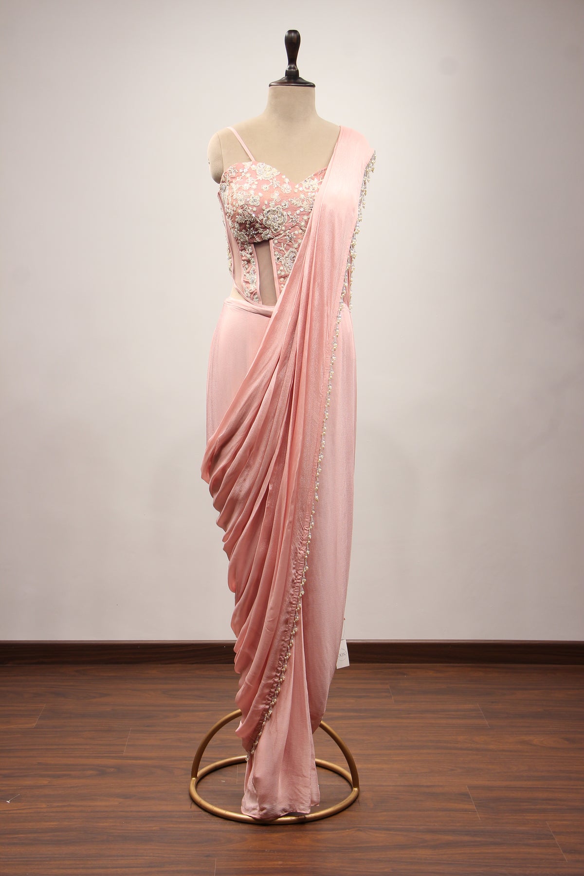 Baby Pink Crepe Drape Saree with Hand Embroidery & Resham Net Corset – front view