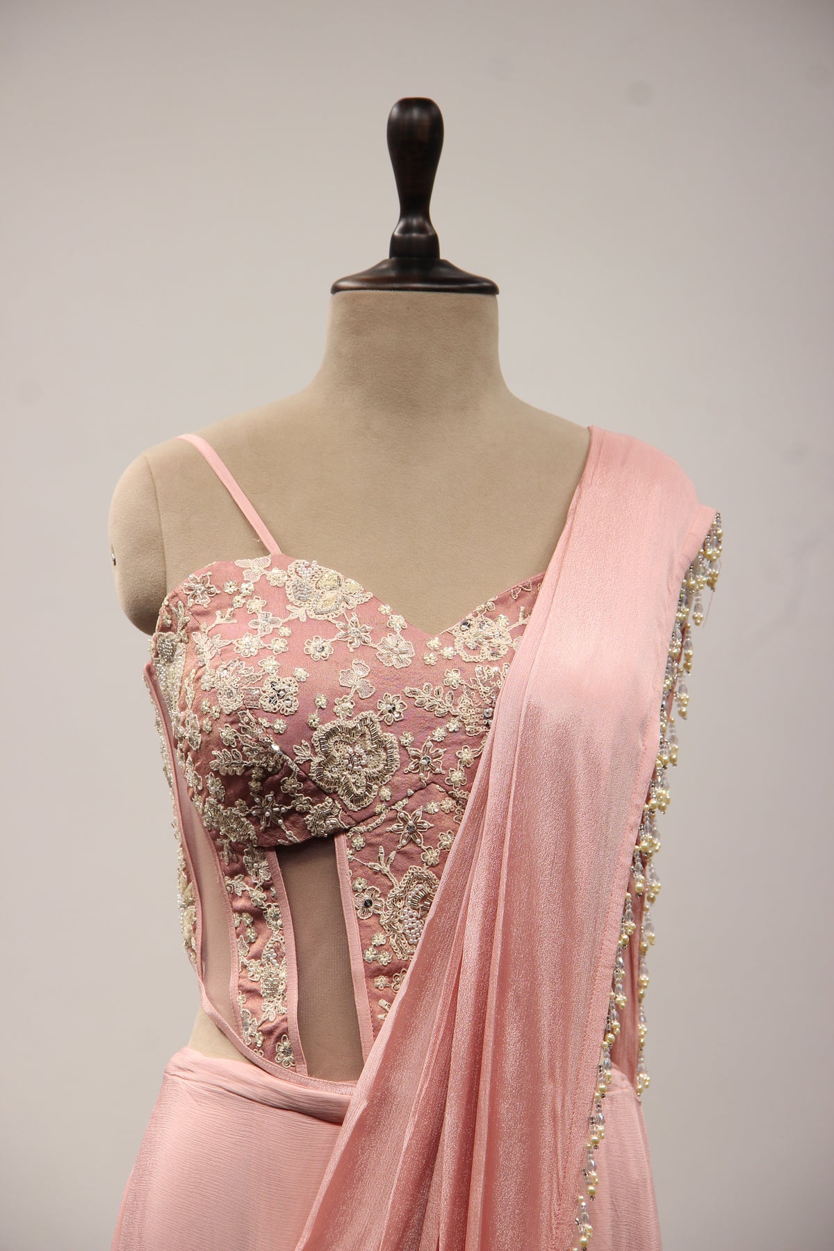 Baby Pink Crepe Drape Saree with Hand Embroidery & Resham Net Corset – front close-up
