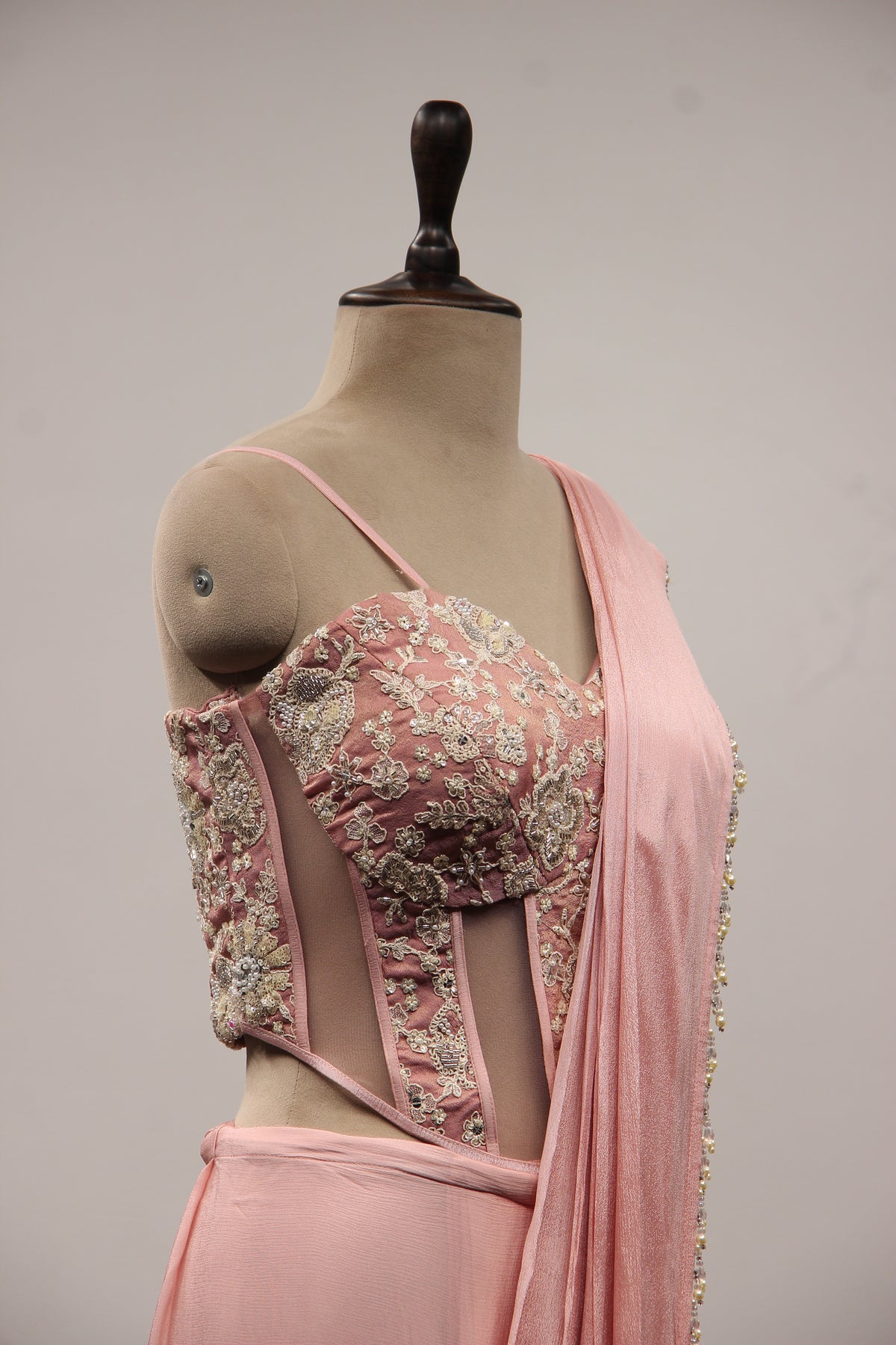 Baby Pink Crepe Drape Saree with Hand Embroidery & Resham Net Corset – side close-up