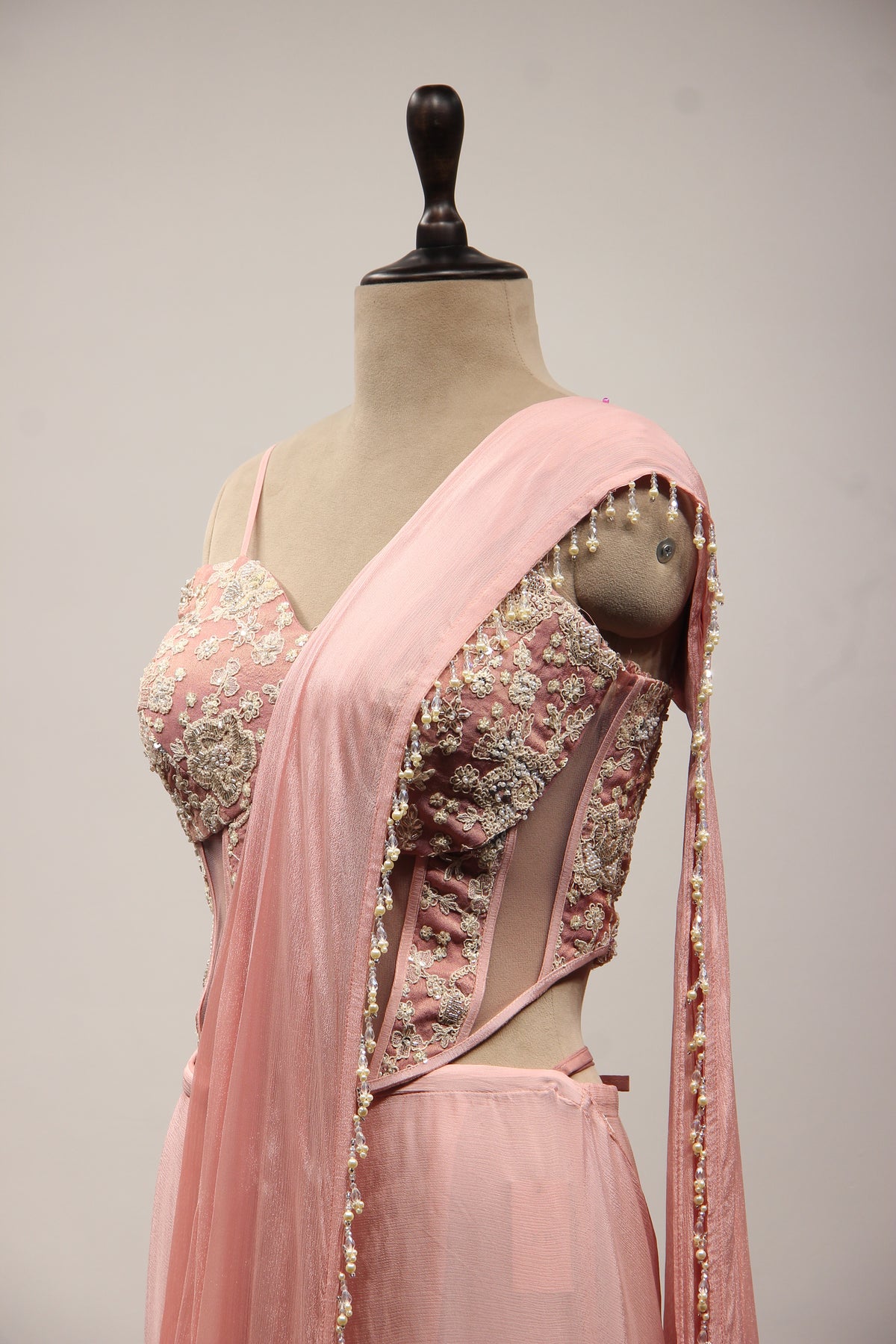Baby Pink Crepe Drape Saree with Hand Embroidery & Resham Net Corset – other side close-up