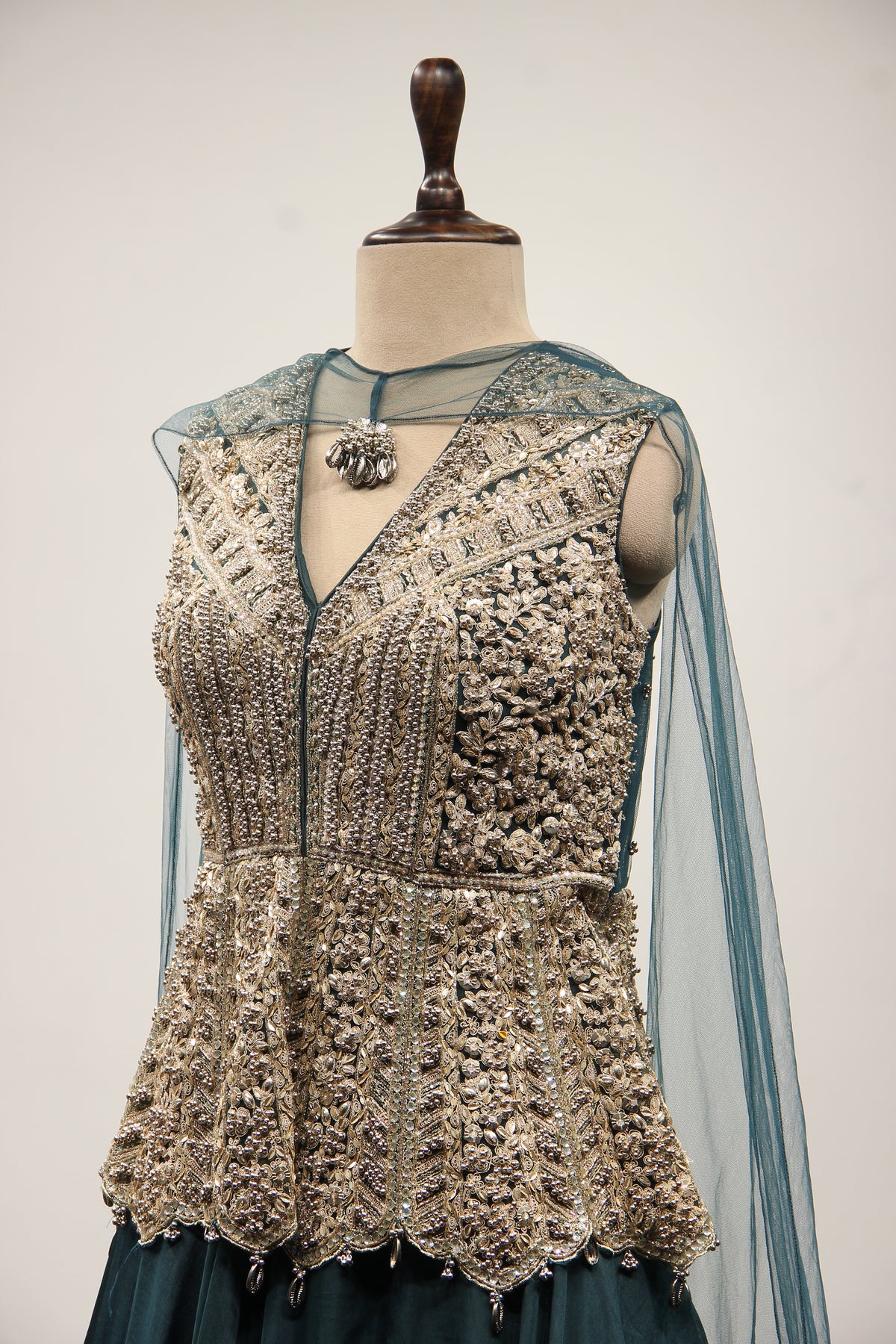 Bottle Green Organza Peplum Lehenga with Zari & Cut Dana Handwork – side close-up
