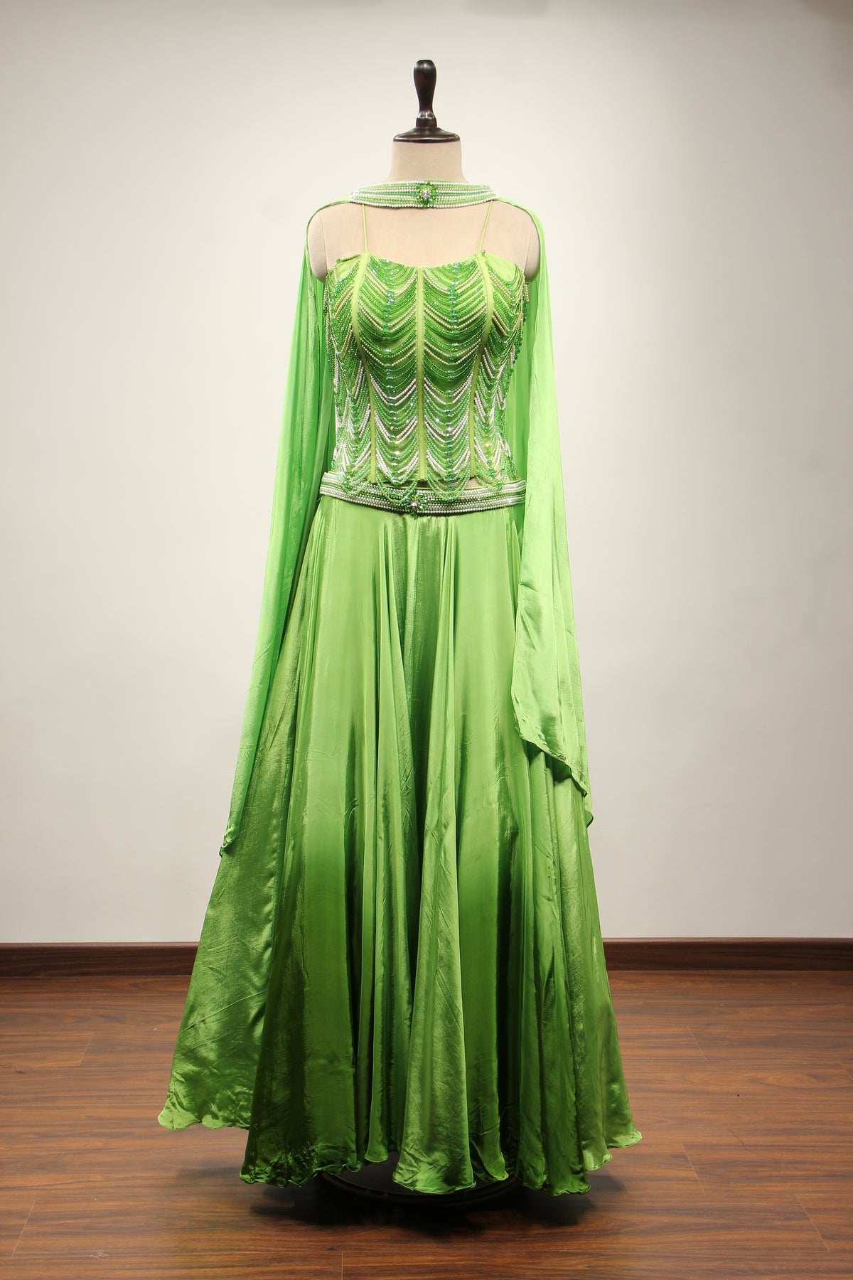 Green Crepe Lehenga with Hand Embroidery & Bead Handwork Net Corset – front view