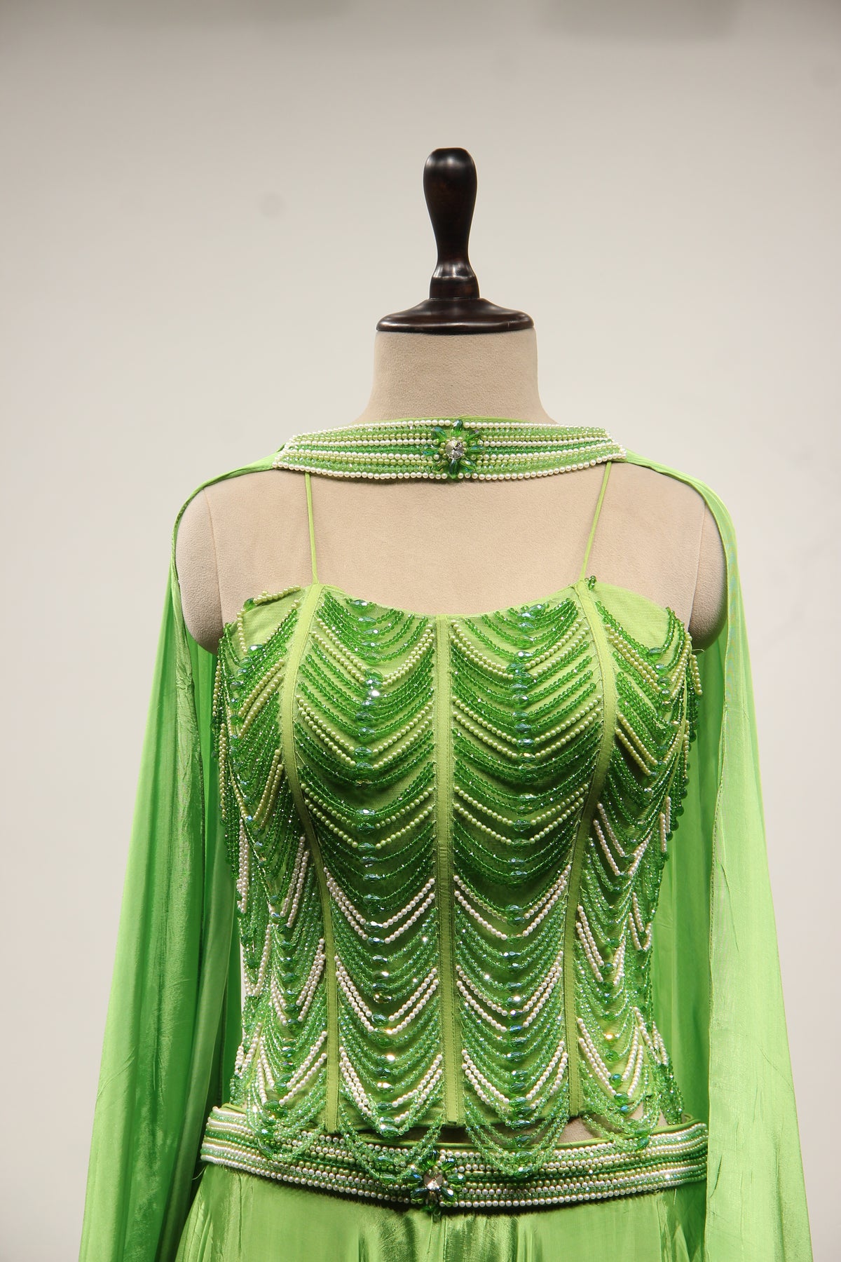 Green Crepe Lehenga with Hand Embroidery & Bead Handwork Net Corset – front close-up