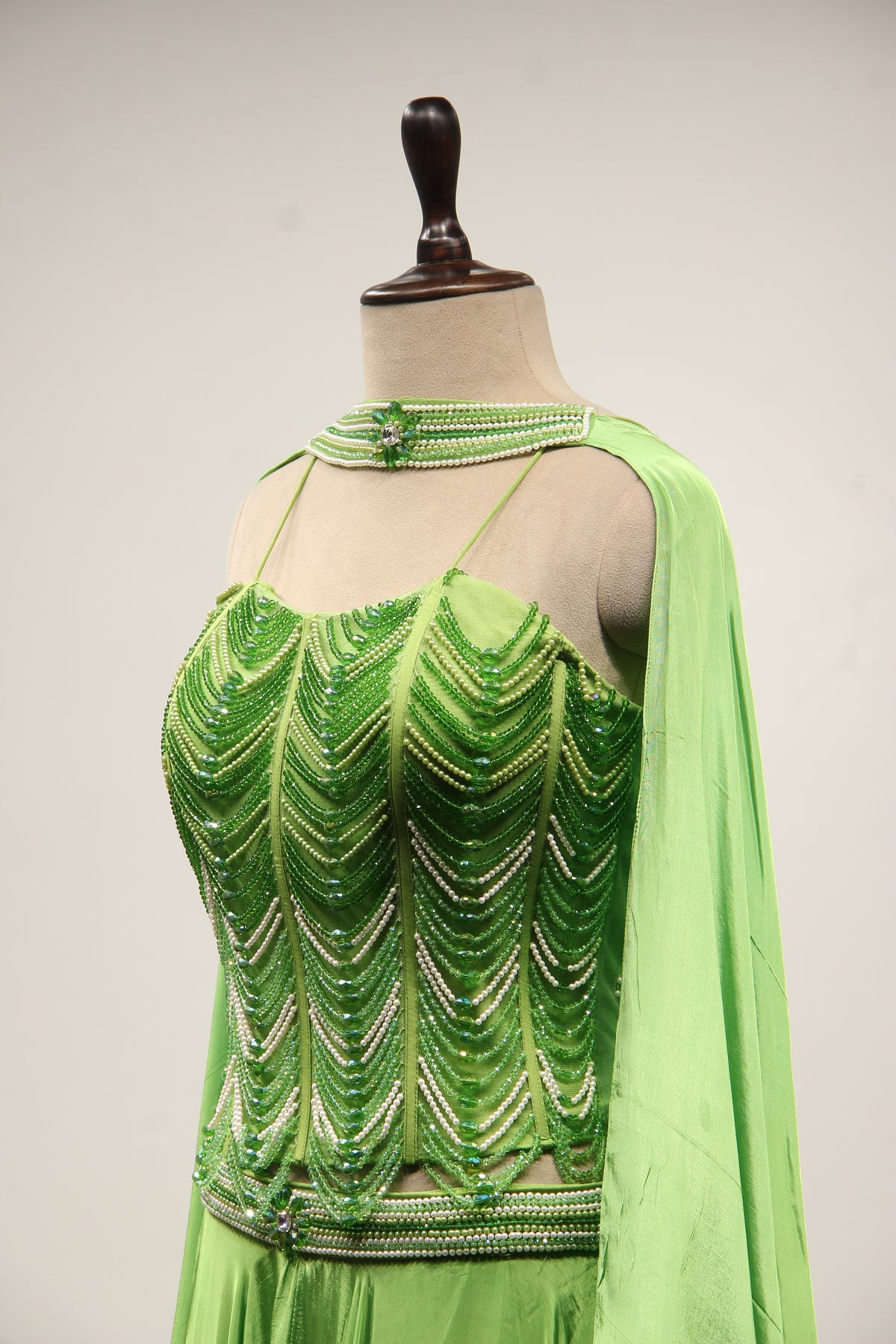Green Crepe Lehenga with Hand Embroidery & Bead Handwork Net Corset – side close-up