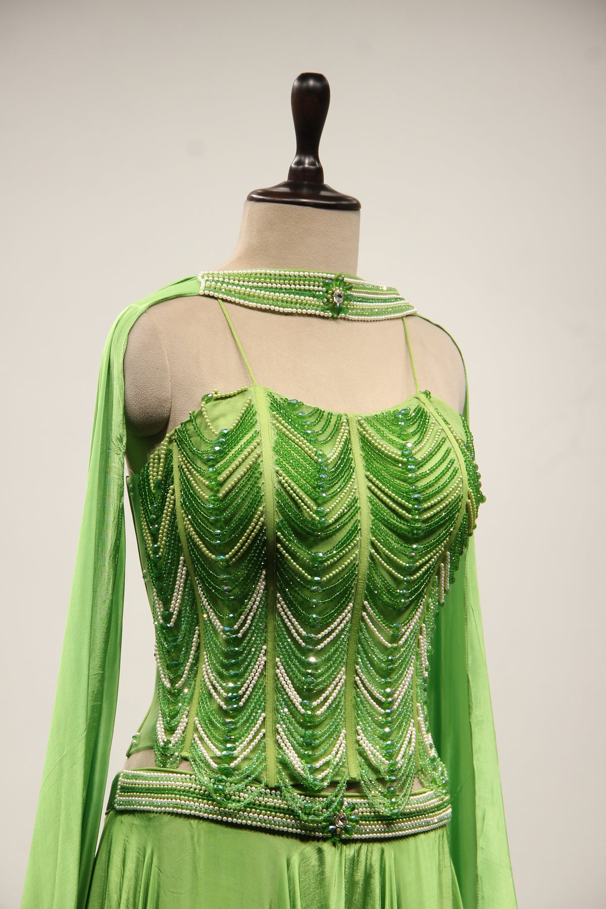 Green Crepe Lehenga with Hand Embroidery & Bead Handwork Net Corset – other side close-up