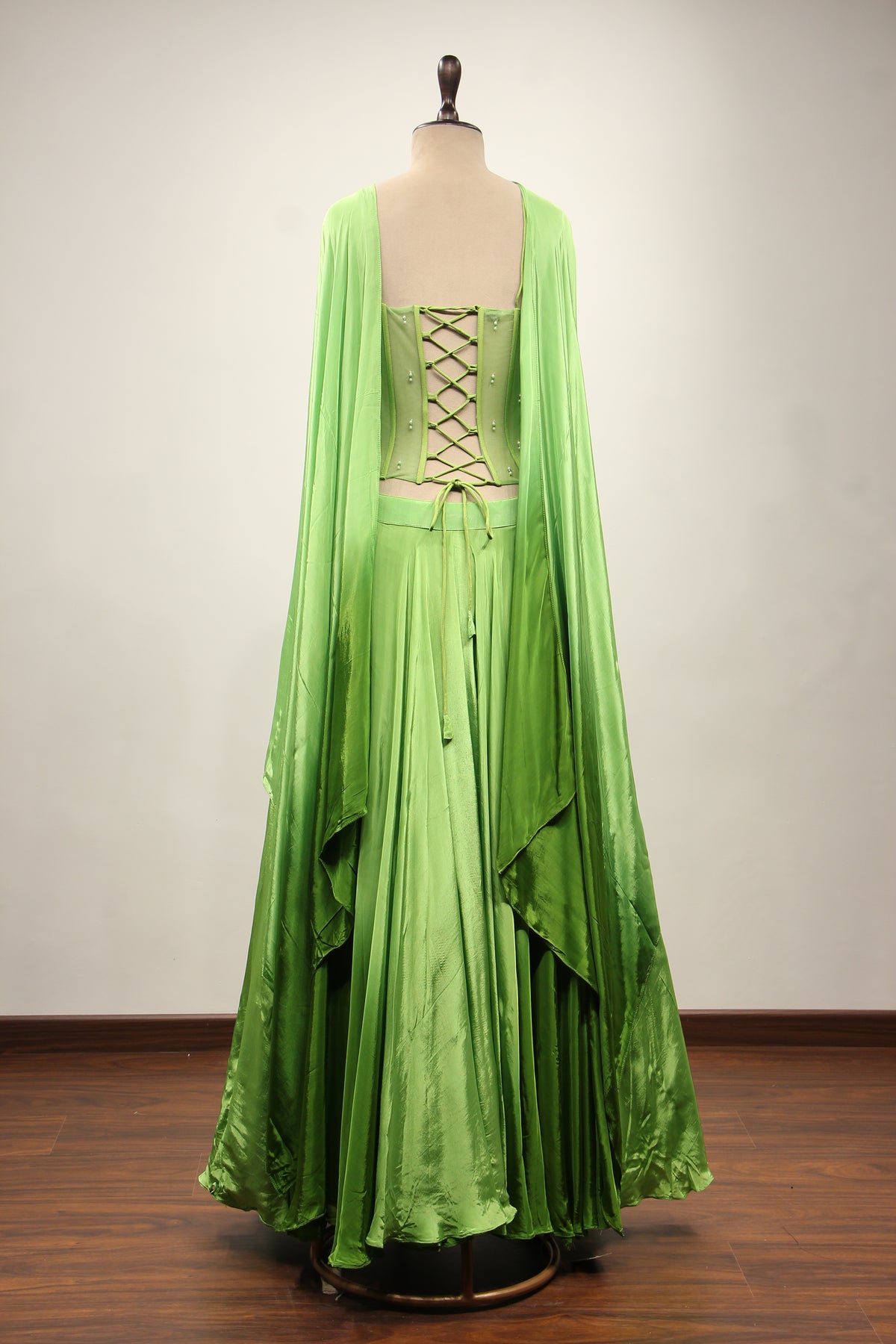Green Crepe Lehenga with Hand Embroidery & Bead Handwork Net Corset – back view