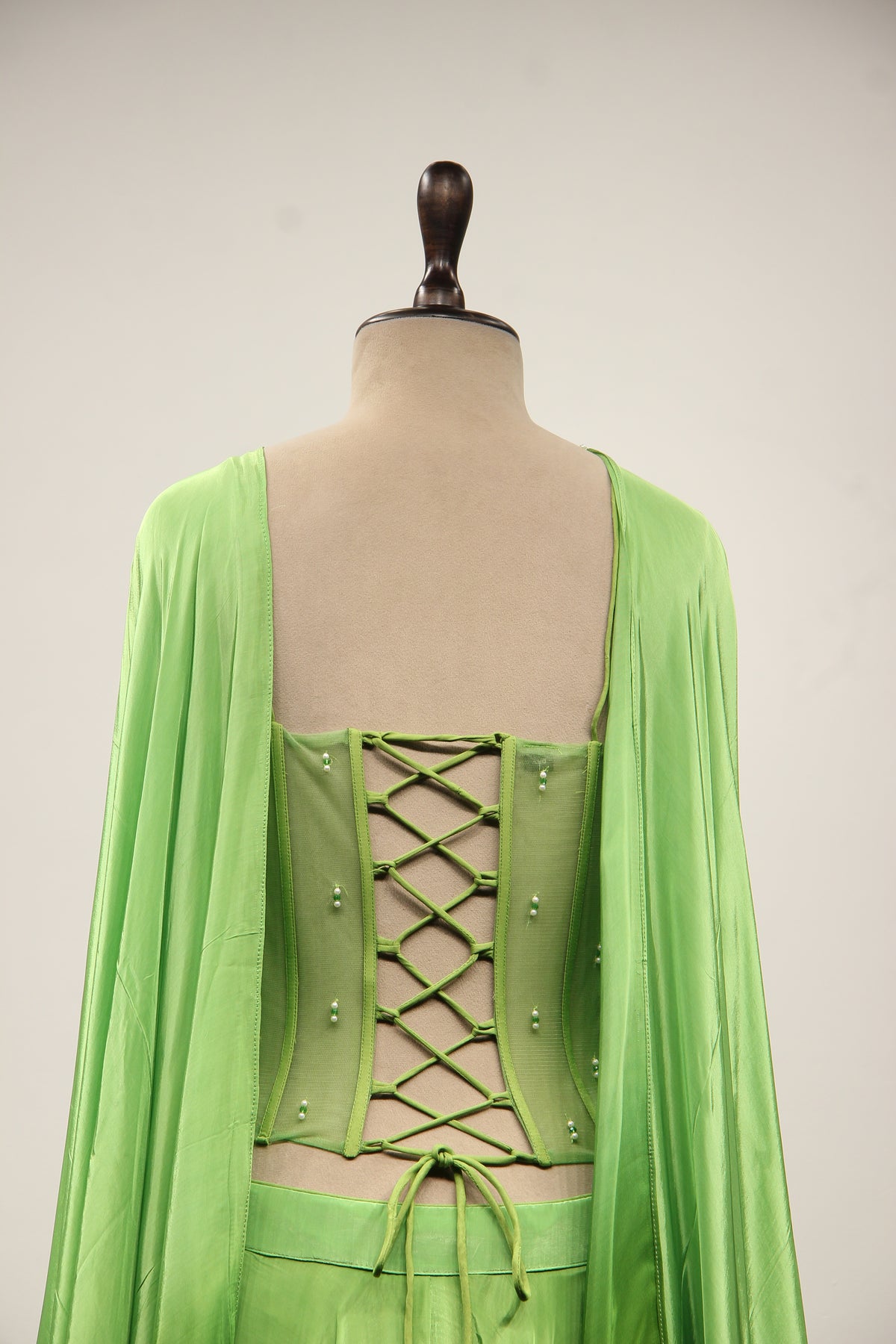 Green Crepe Lehenga with Hand Embroidery & Bead Handwork Net Corset – back close-up