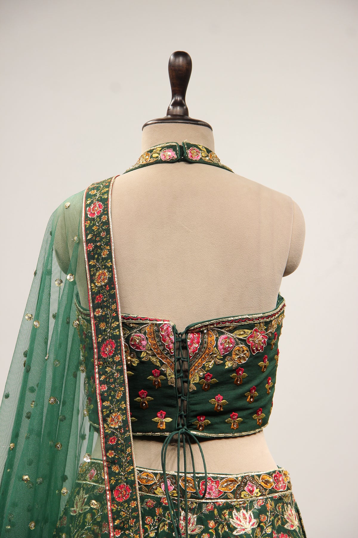Bottle Green Dupion Halter Lehenga with Printed & Gota Patti Handwork – back close-up