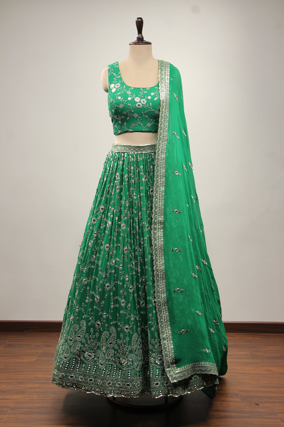 Georgette Lehenga with Mirror & Sequin Handwork Twist Front Crop Top in Green – front view