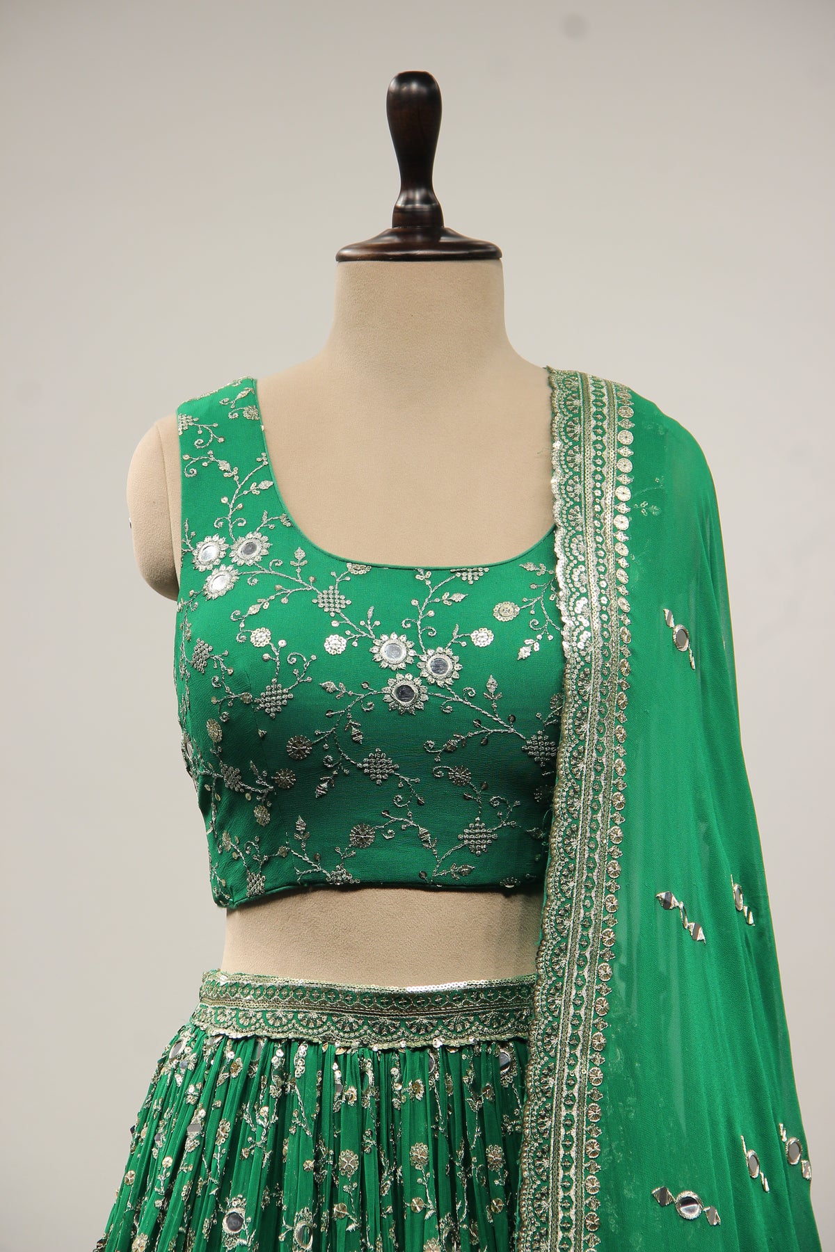 Georgette Lehenga with Mirror & Sequin Handwork Twist Front Crop Top in Green – front close-up